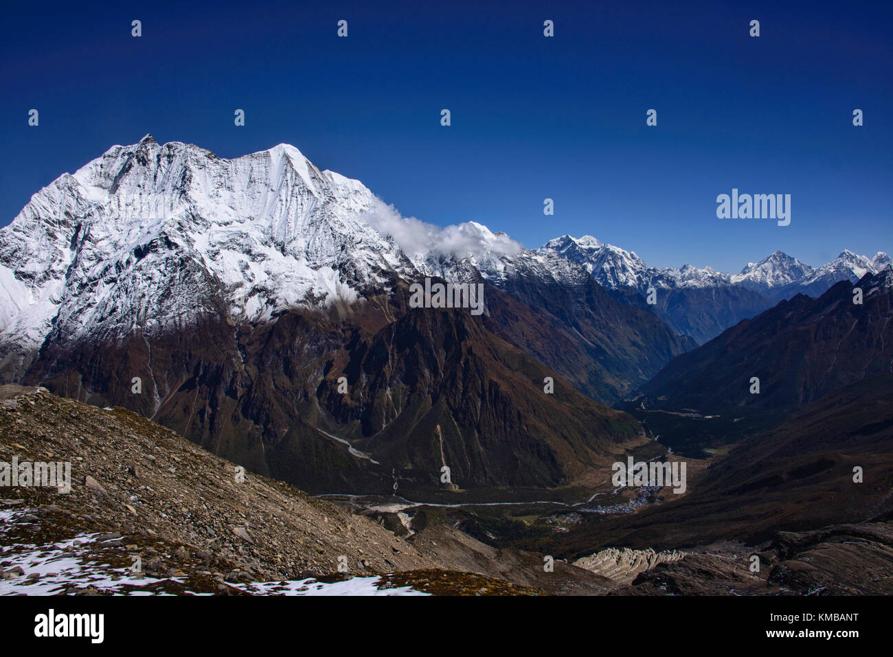 Looking out at Birendra Tal and Kutang Himal on the Tibetan border from the Manaslu Basecamp trail, Nepal Stock Photo