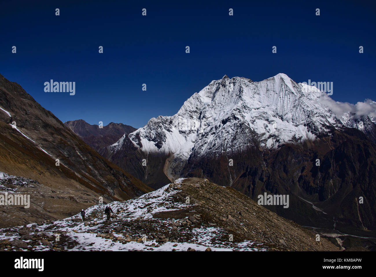 Looking out at Birendra Tal and Kutang Himal on the Tibetan border from the Manaslu Basecamp trail, Nepal Stock Photo
