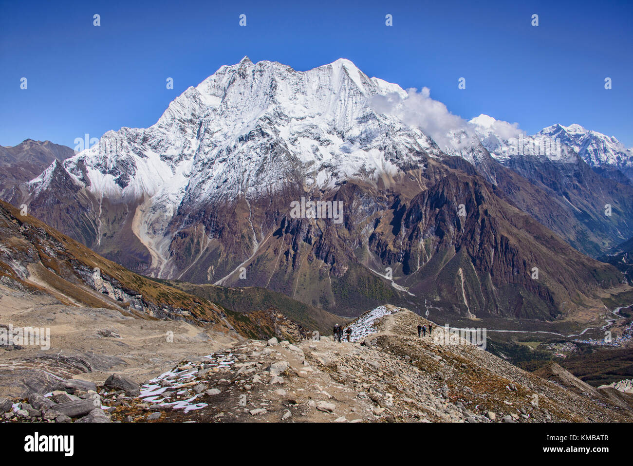 Looking out at Birendra Tal and Kutang Himal on the Tibetan border from the Manaslu Basecamp trail, Nepal Stock Photo