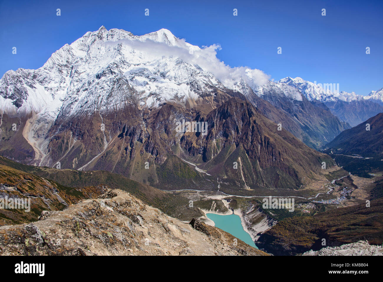Looking out at Birendra Tal and Kutang Himal on the Tibetan border from the Manaslu Basecamp trail, Nepal Stock Photo