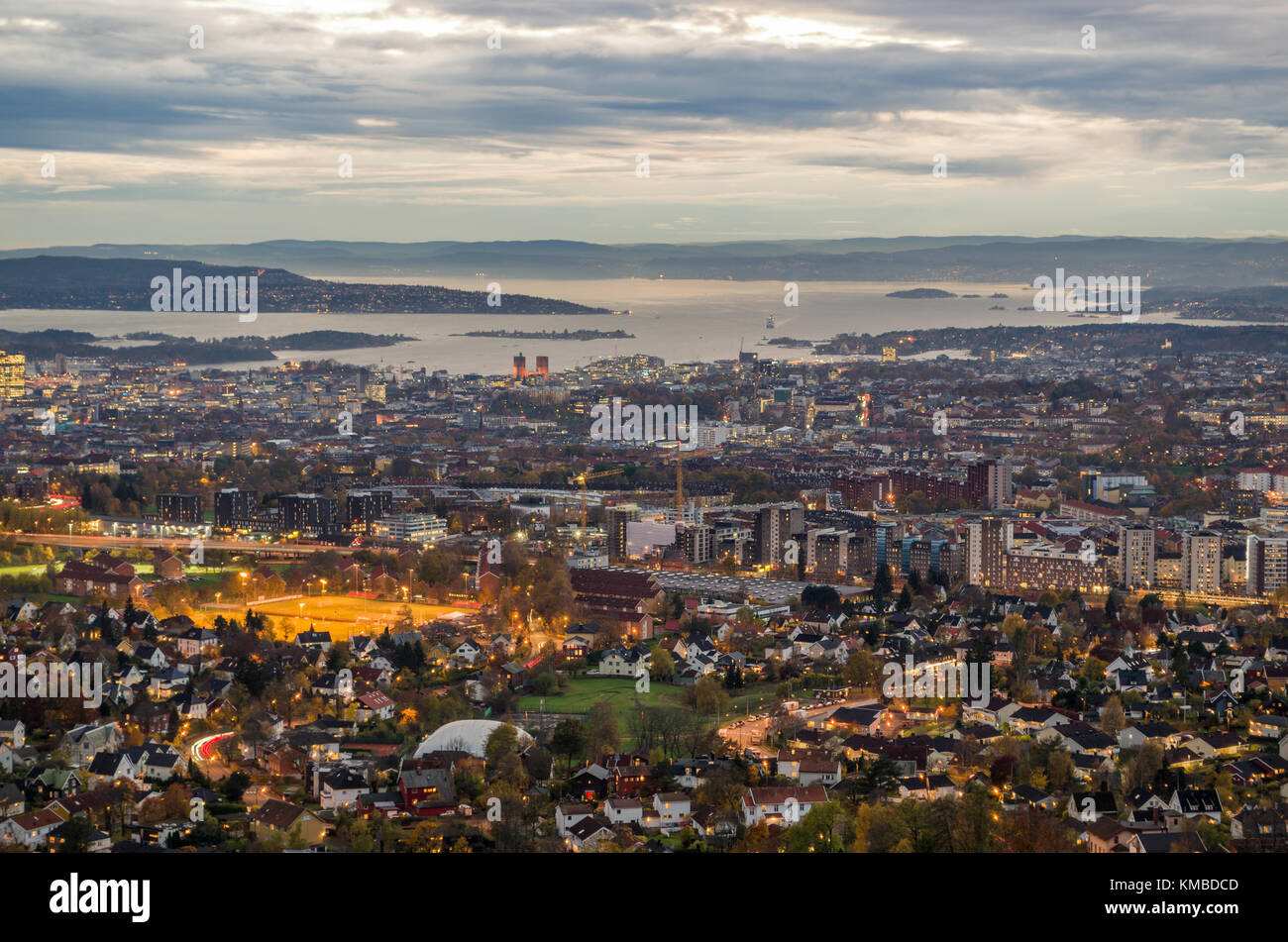 Panoramic, general, long distance, aerial view of Oslo, capitol of Norway,  at sunset in cloudy autumn day. Stock Photo