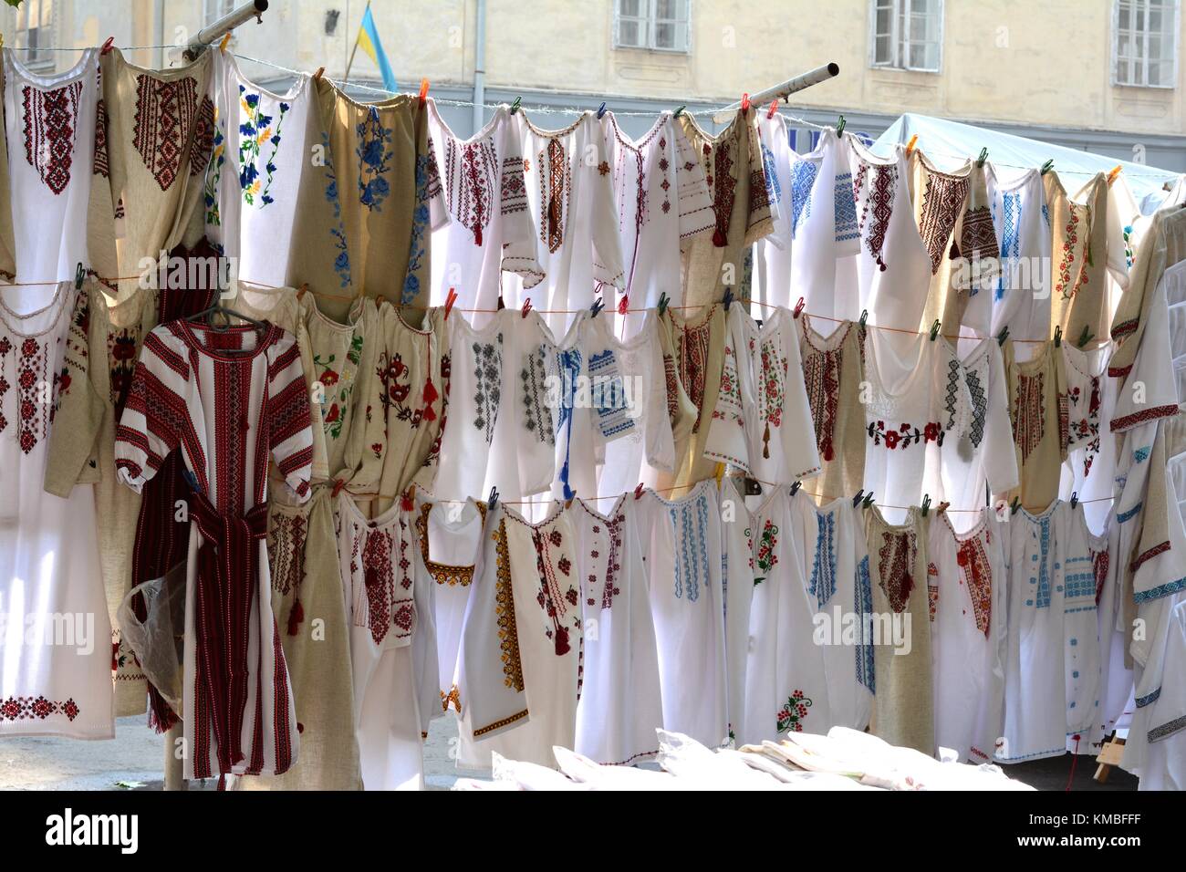 'Vyshyvanky', traditional Ukrainian embroidered shirts hanging on clotheslines in a market Stock Photo