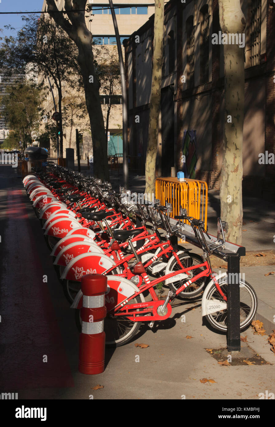 Parked bikes for hire in 22@ Innovation district Barcelona Spain Stock Photo
