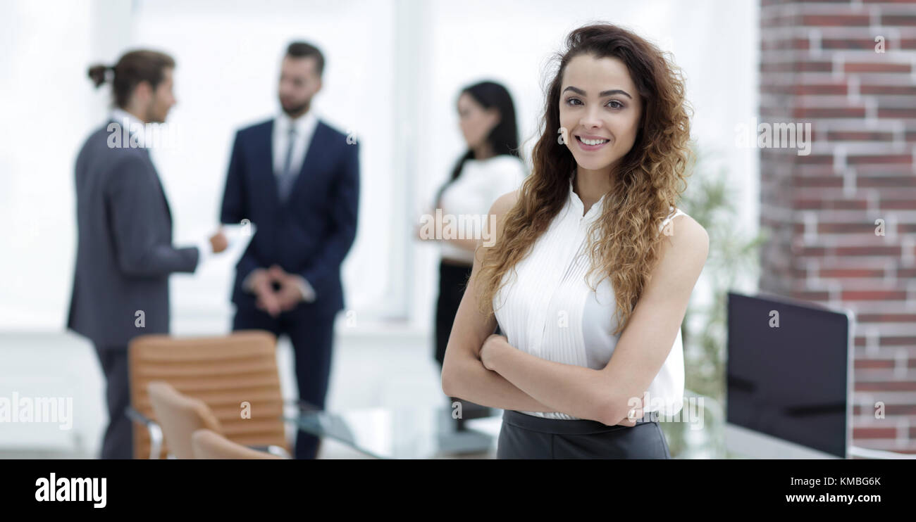 beautiful woman on the background of business people Stock Photo - Alamy