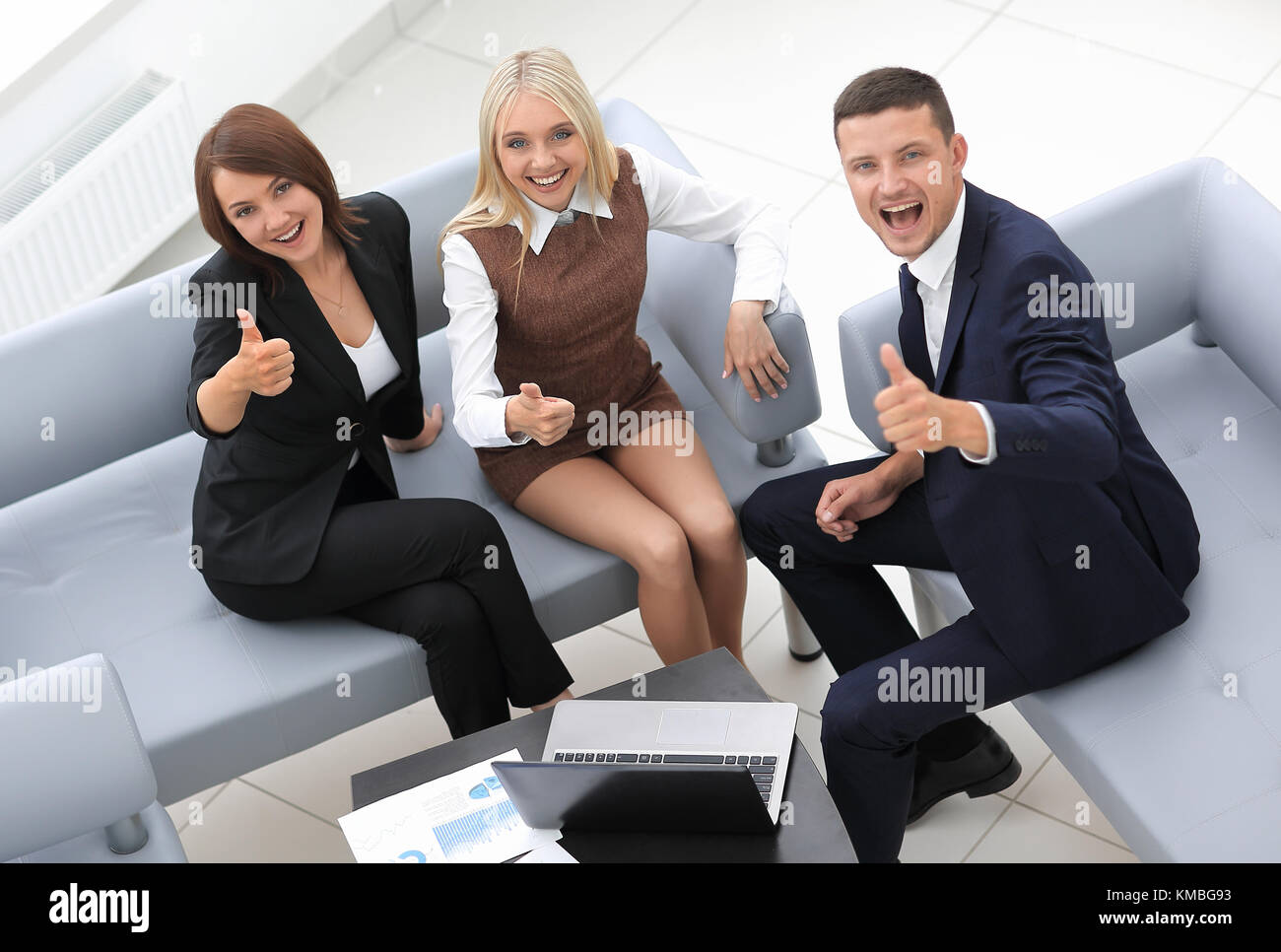 successful business team sitting in the lobby of the office Stock Photo ...