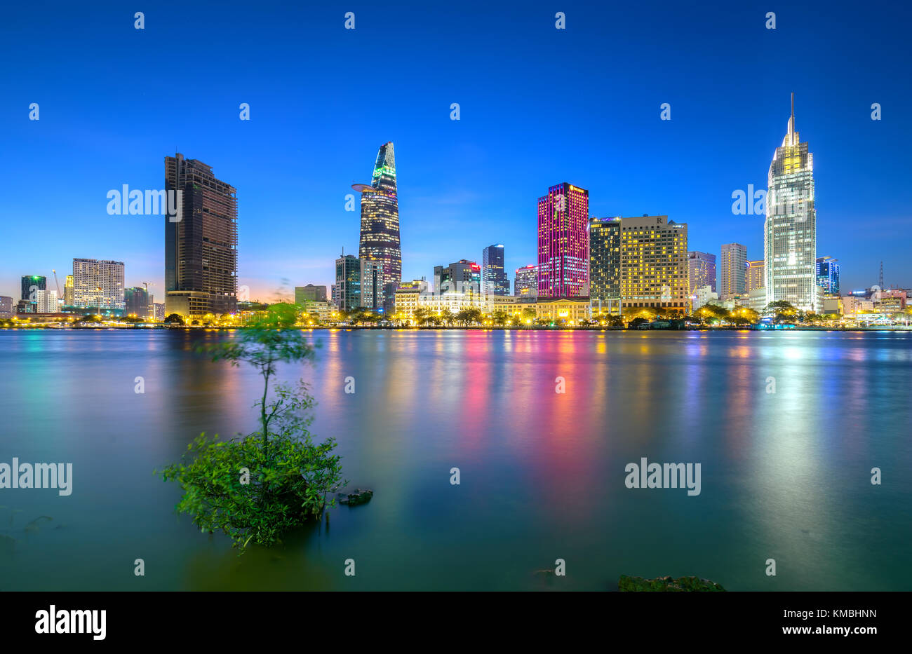 Beauty skyscrapers along river light smooth down urban development in Ho Chi Minh City, Vietnam Stock Photo