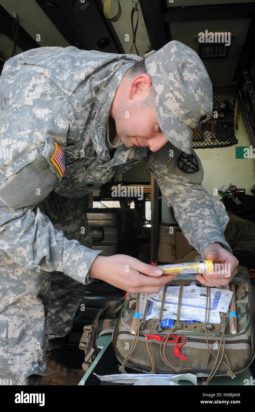 U.S. Army Spc. Daniel Q. Fimbres, a healthcare specialist with the 7385th Blood Detachment at Ft. Bragg, N.C., checks equipment in the field litter ambulance during the 20th Annual Randy Oler Memorial Operation Toy Drop Nov 30, 2017. Operation Toy Drop is the world’s largest combined airborne operation with eight partner nation paratroopers participating and allows Soldiers the opportunity to train on their military occupational specialty, maintain their airborne readiness, and give back to the local community. (U.S. Army Stock Photo
