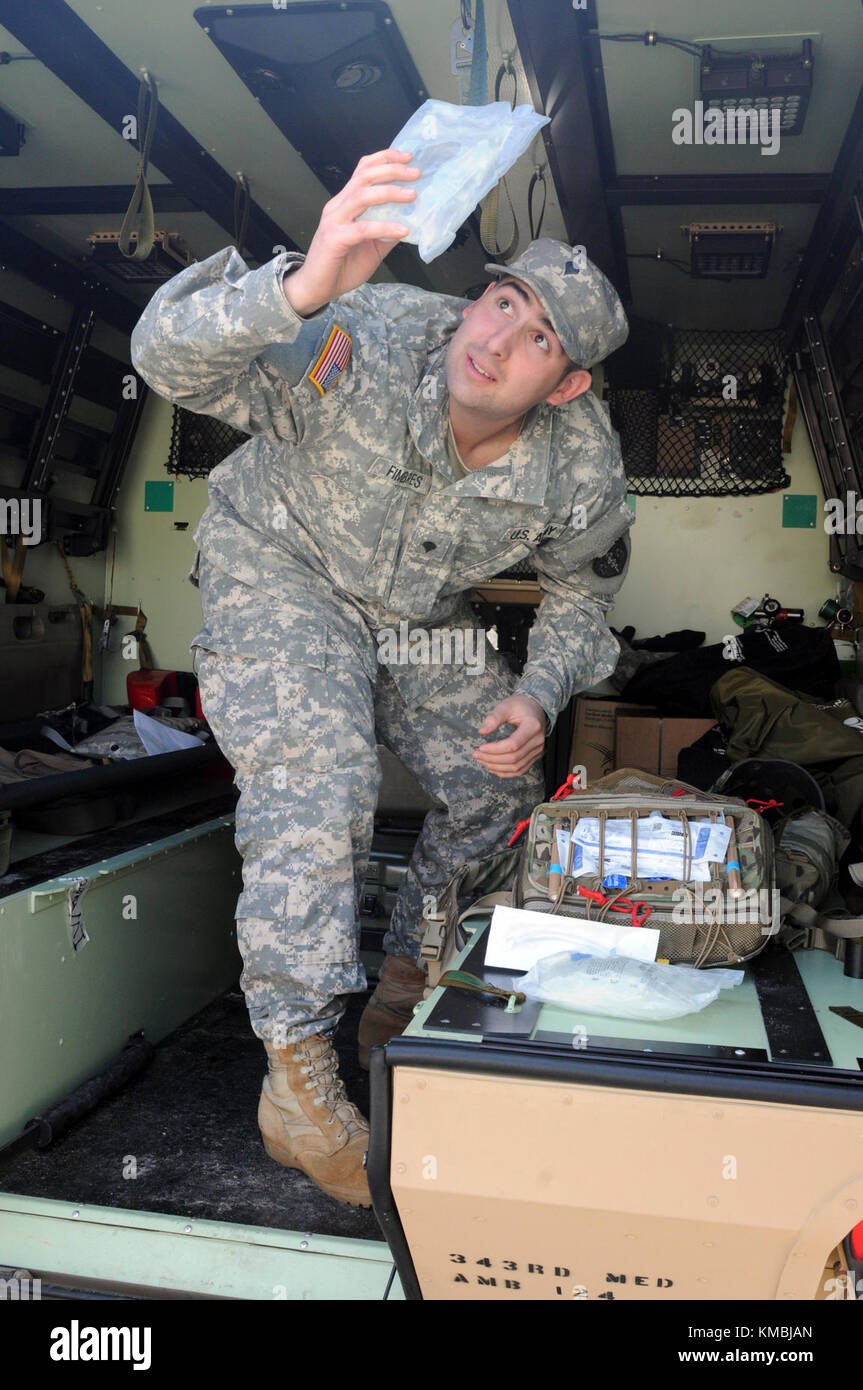 U.S. Army Spc. Daniel Q. Fimbres, a healthcare specialist with the 7385th Blood Detachment at Ft. Bragg, N.C., checks equipment in the field litter ambulance during the 20th Annual Randy Oler Memorial Operation Toy Drop Nov 30, 2017. Operation Toy Drop is the world’s largest combined airborne operation with eight partner nation paratroopers participating and allows Soldiers the opportunity to train on their military occupational specialty, maintain their airborne readiness, and give back to the local community. (U.S. Army Stock Photo