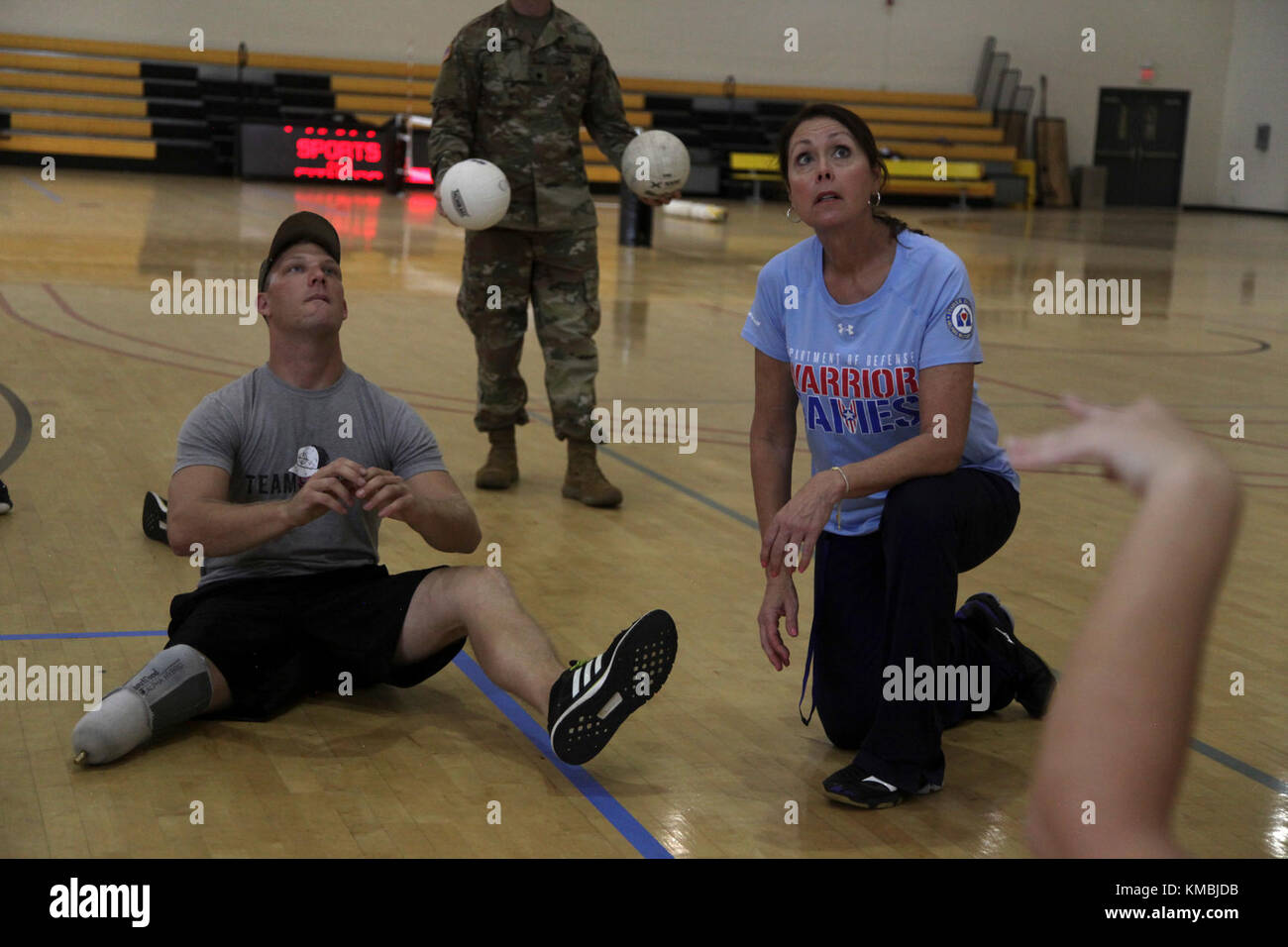 Coach Linda Gomez gives some tips to Sgt. Sean-Micahael Horn about the sitting voilleyball event for the Atlantic and Central Regional Trials at Fort Benning, Georgia on Nov. 30, 2017. Wounded, ill or injured active-duty Soldiers and veterans are expected to converge on Fort Benning's Warrior Transition Battalion, Nov. 30 through Dec. 8, as the unit plays host to the 2017 U.S. Army Regional Health Command-Atlantic's and Central's annual Warrior Games Regional Trials. (U.S. Army Stock Photo