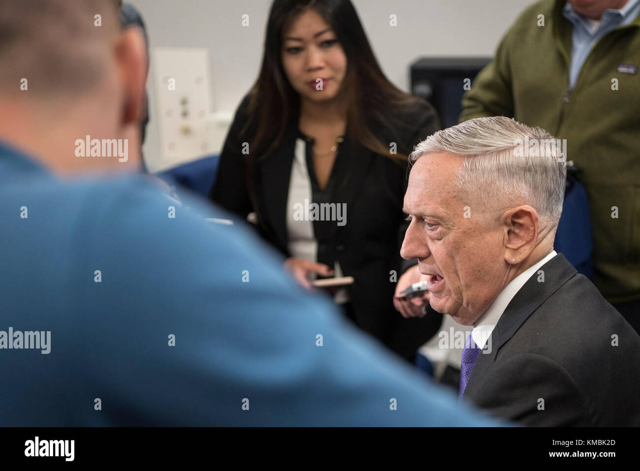 Defense Secretary James N. Mattis speaks with the press during a flight ...