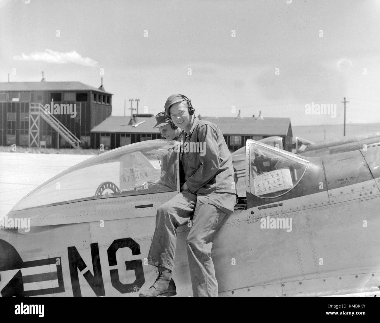 Thornton 'Beck' Becklund, of the 178th Fighter Squadron, North Dakota Air National Guard, smiles as he sits on an F-51 Mustang aircraft during a summer camp annual training period at Casper, Wyoming, 1949. Becklund went on to become the 119th Fighter Group commander in 1981 and was promoted to brigadier general as the N.D. Air National Guard chief of staff in 1988. Stock Photo