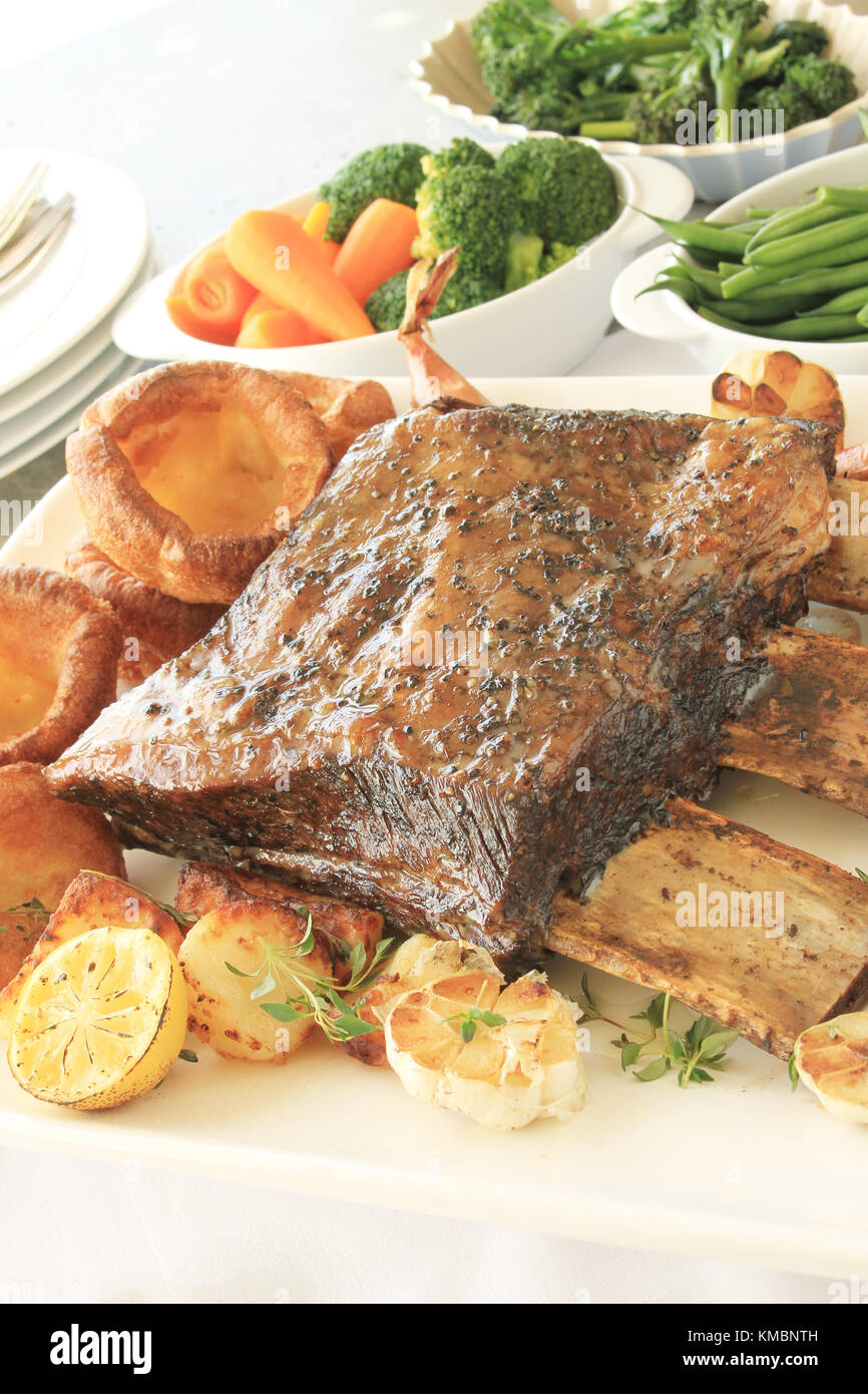 large beef rib sunday roast dinner Stock Photo Alamy