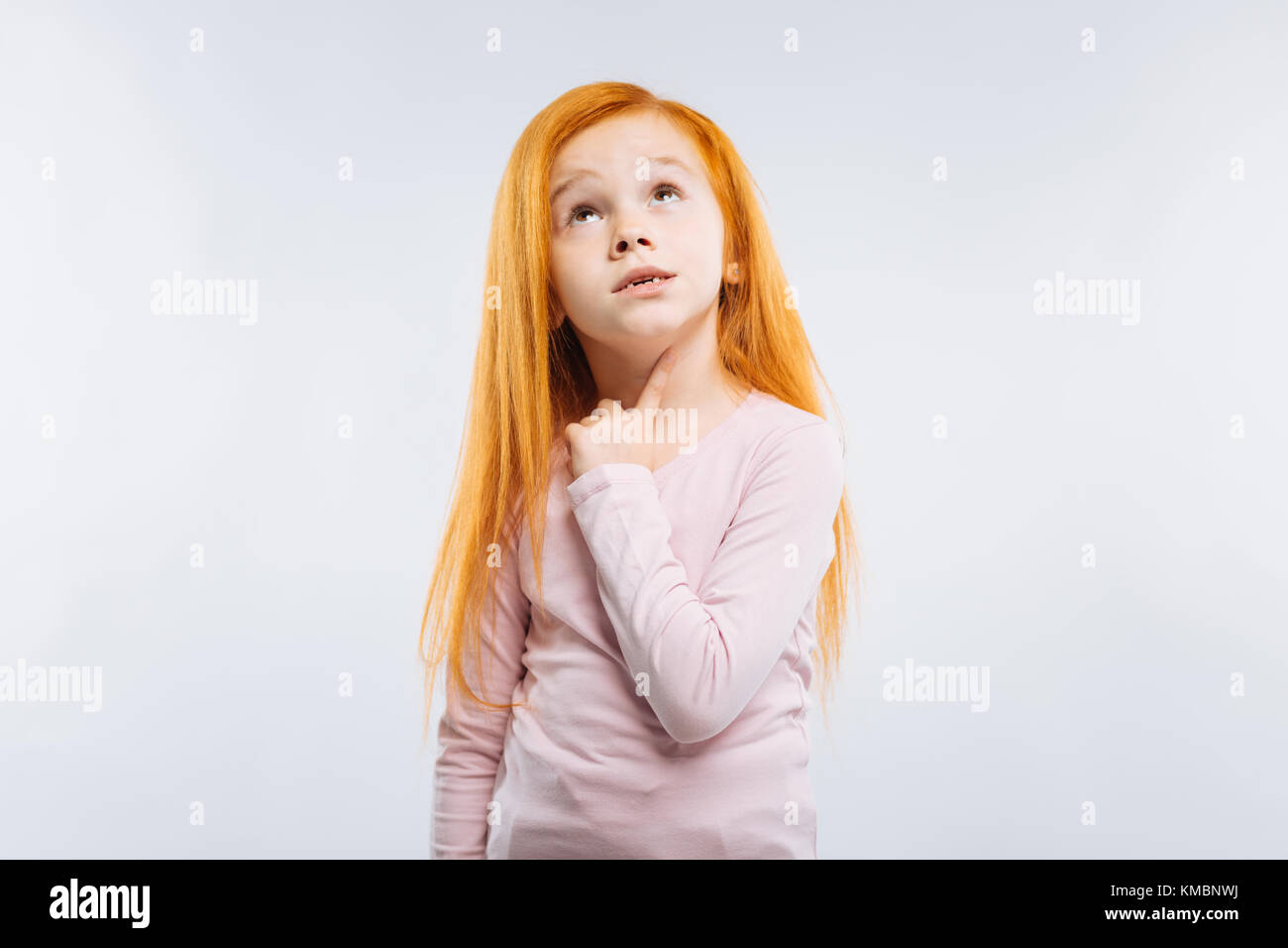 Surprised child raising her eyebrows Stock Photo Alamy