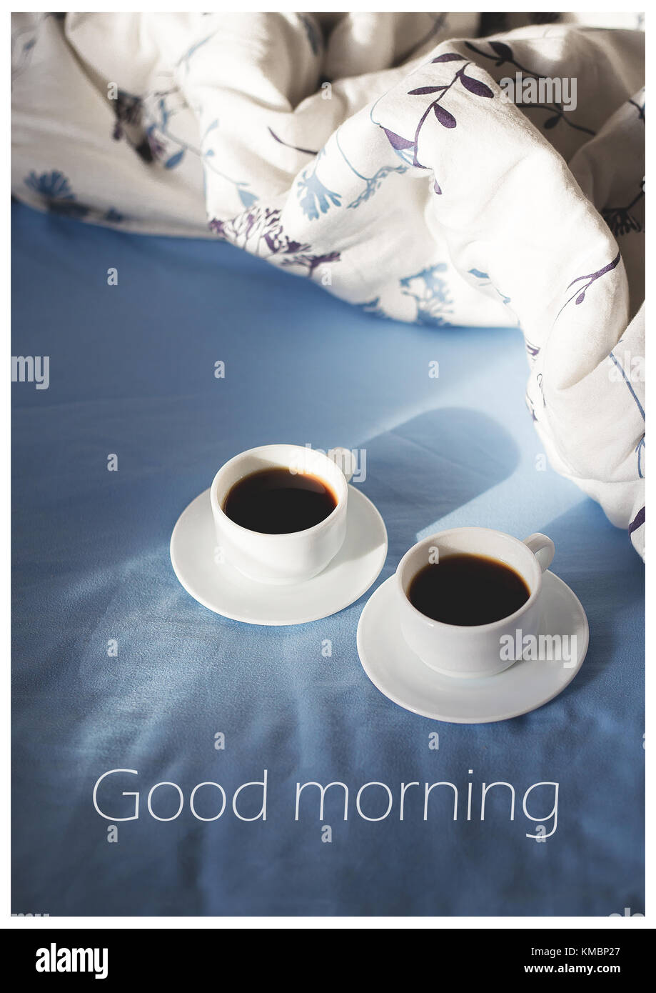 two cups of coffee are in bed, writing good morning Stock Photo ...