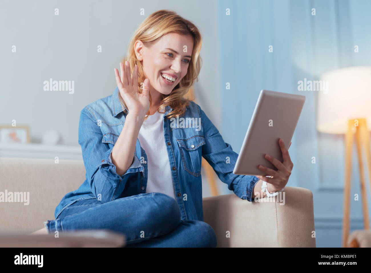 Happy smiling woman sitting and having a video call with a friend Stock ...