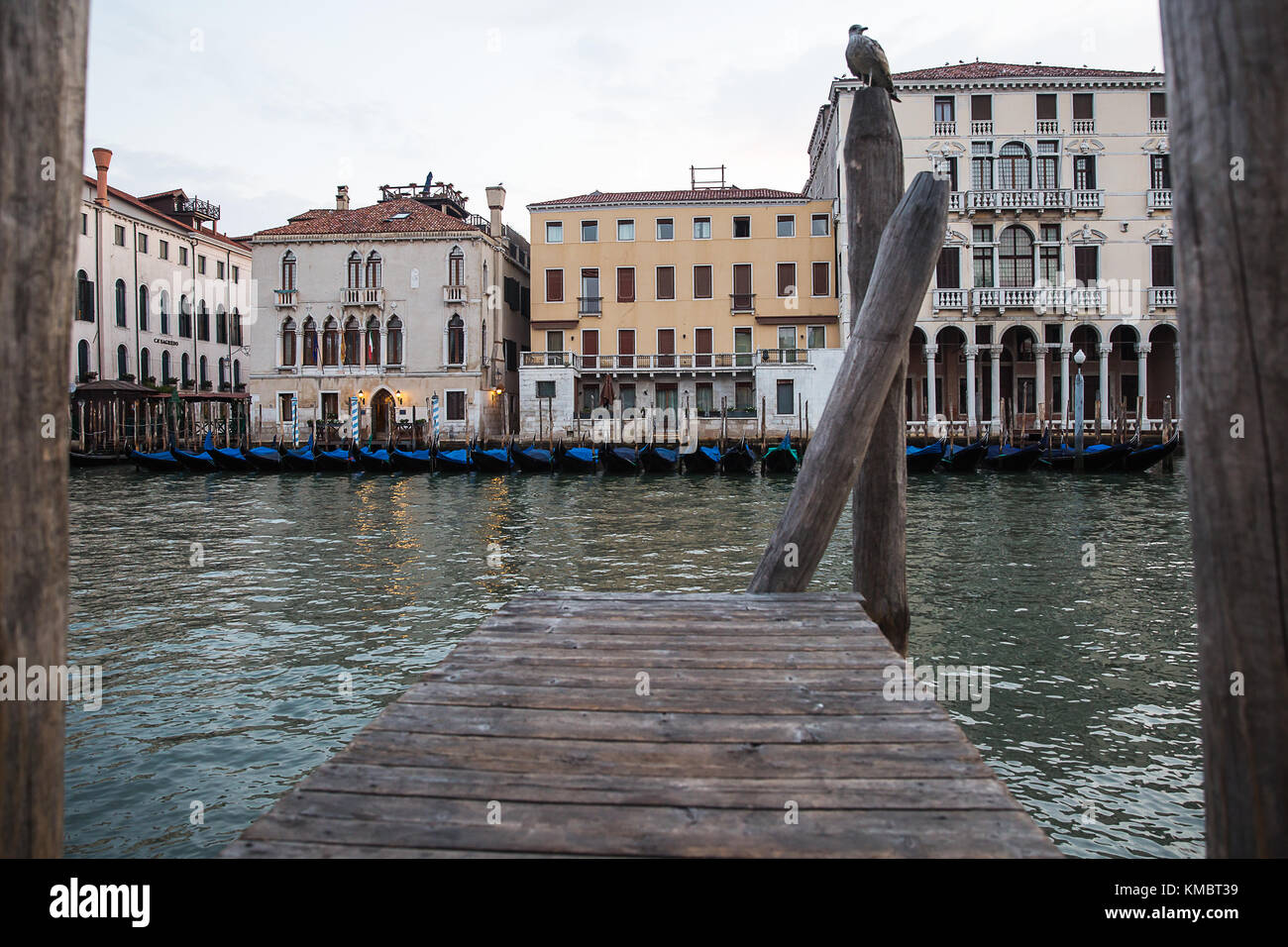 Beautiful photo of the Venetian canal with gondolas , Italy . Stock Photo