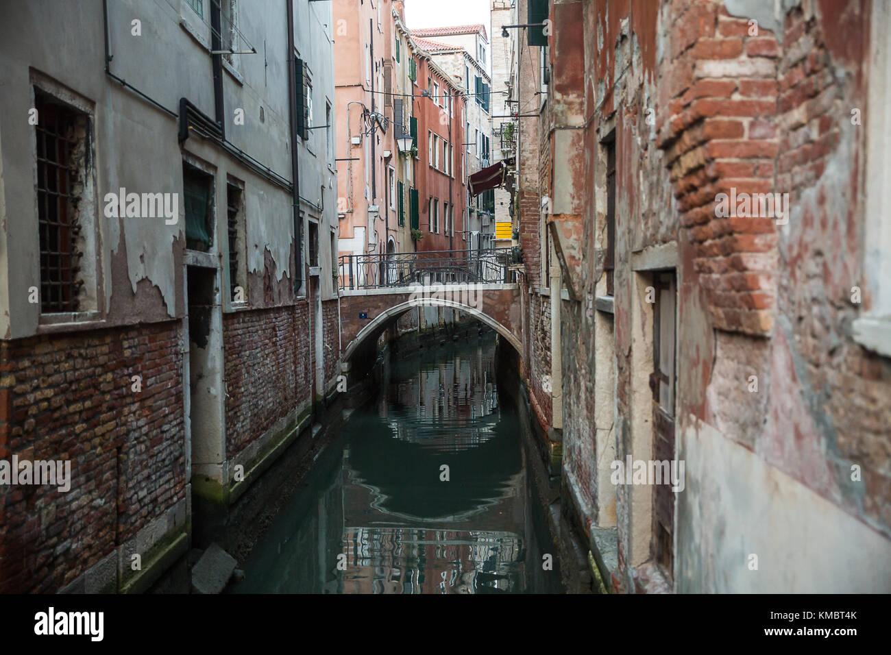 Beautiful photo of the Venetian canal with old houses , Italy . Stock Photo