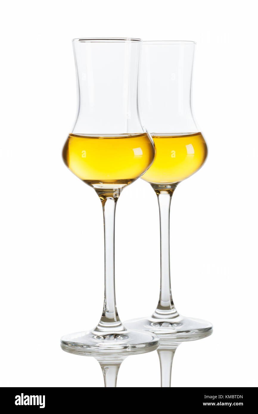 Two glasses of italian Grappa brandy isolated on white background Stock Photo