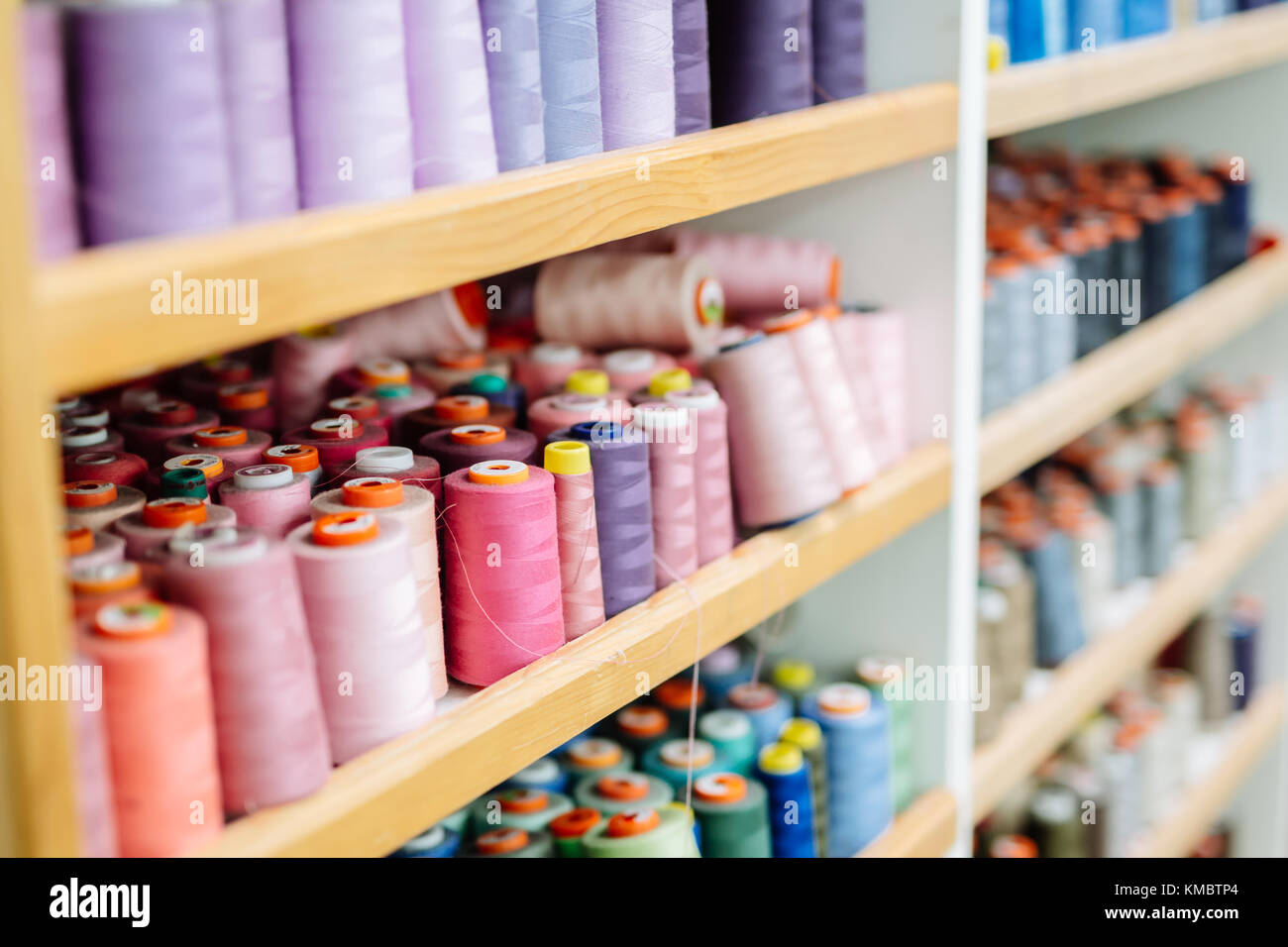 Colorful thread spools used in fabric industry Stock Photo