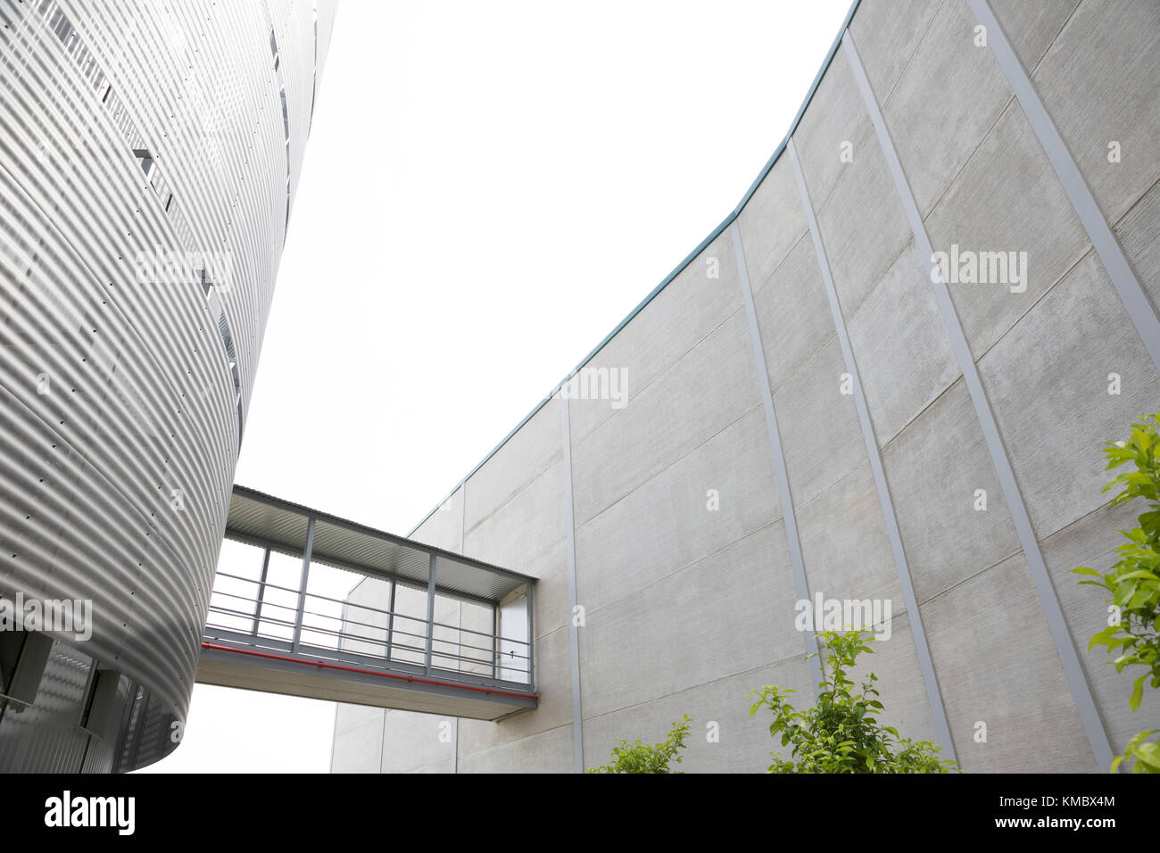 Architectural, modern building with elevated walkway Stock Photo