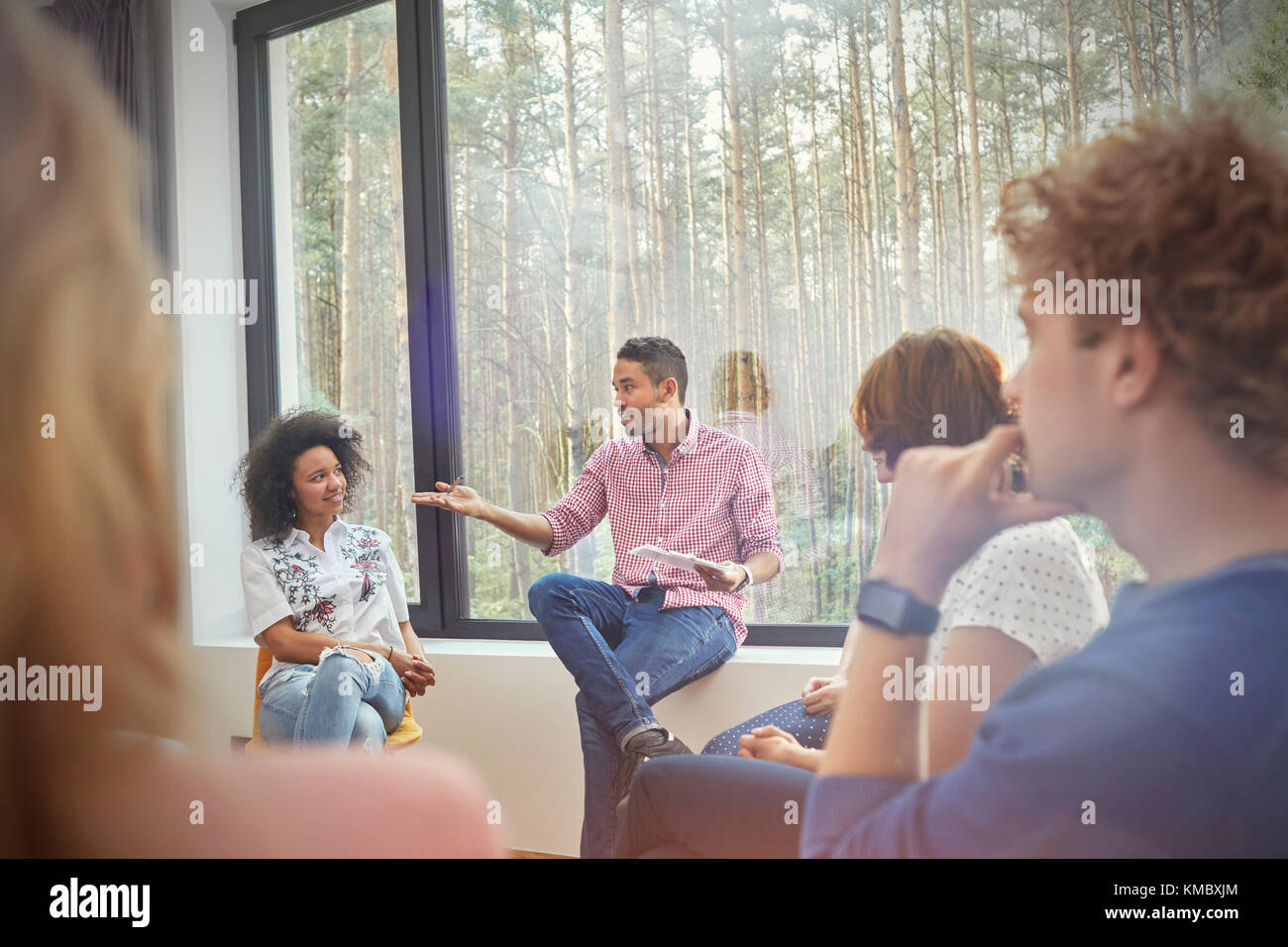 Man talking in group therapy session Stock Photo