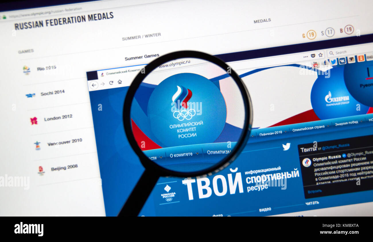 MONTREAL, CANADA - DECEMBER 5, 2017: Russian Olympic Committee web page under magnifying glass. Stock Photo