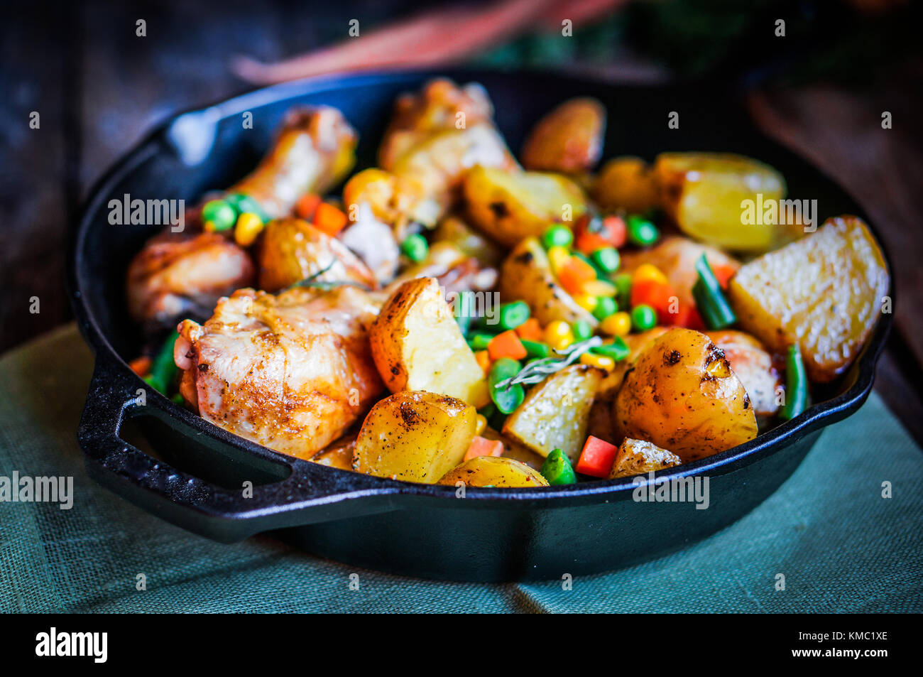 Oven Baked Chicken With Potatoes And Vegetables On Wooden Background Stock Photo Alamy