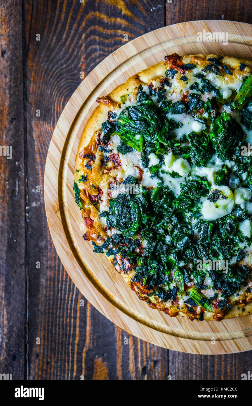 Spinach And Goat Cheese Pizza On Wooden Background Stock Photo Alamy