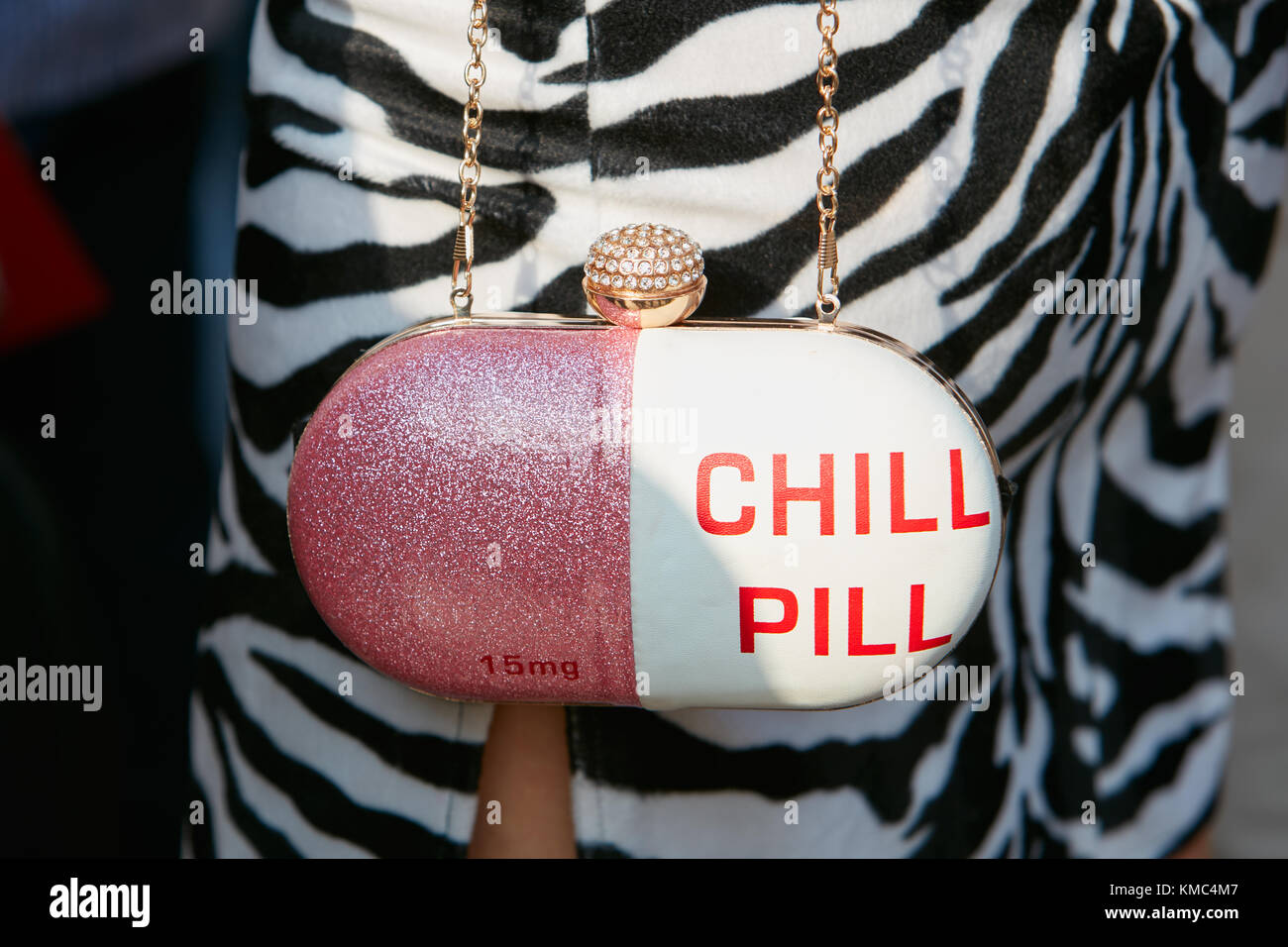 MILAN - SEPTEMBER 23: Woman with pink glitter and white pill shaped bag  before Antonio Marras fashion show, Milan Fashion Week street style on  Septemb Stock Photo - Alamy