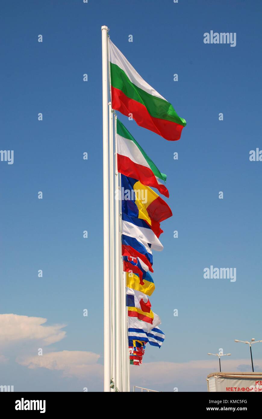A row of various National flags flying at Mandraki harbour on the Greek island of Nisyros. Stock Photo