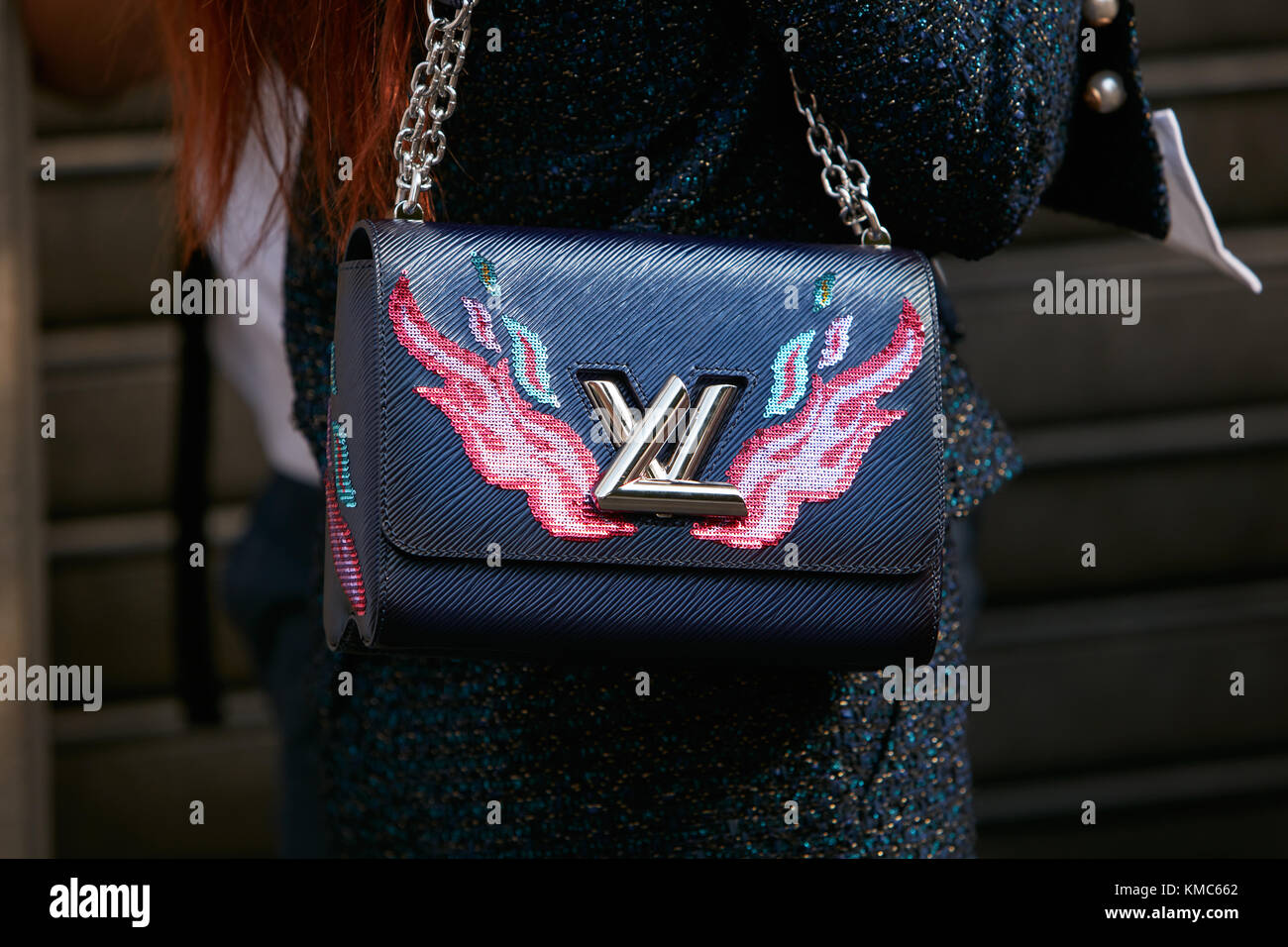 MILAN - SEPTEMBER 23: Woman with black Louis Vuitton bag with pink flames  before Antonio Marras fashion show, Milan Fashion Week street style on  Septe Stock Photo - Alamy