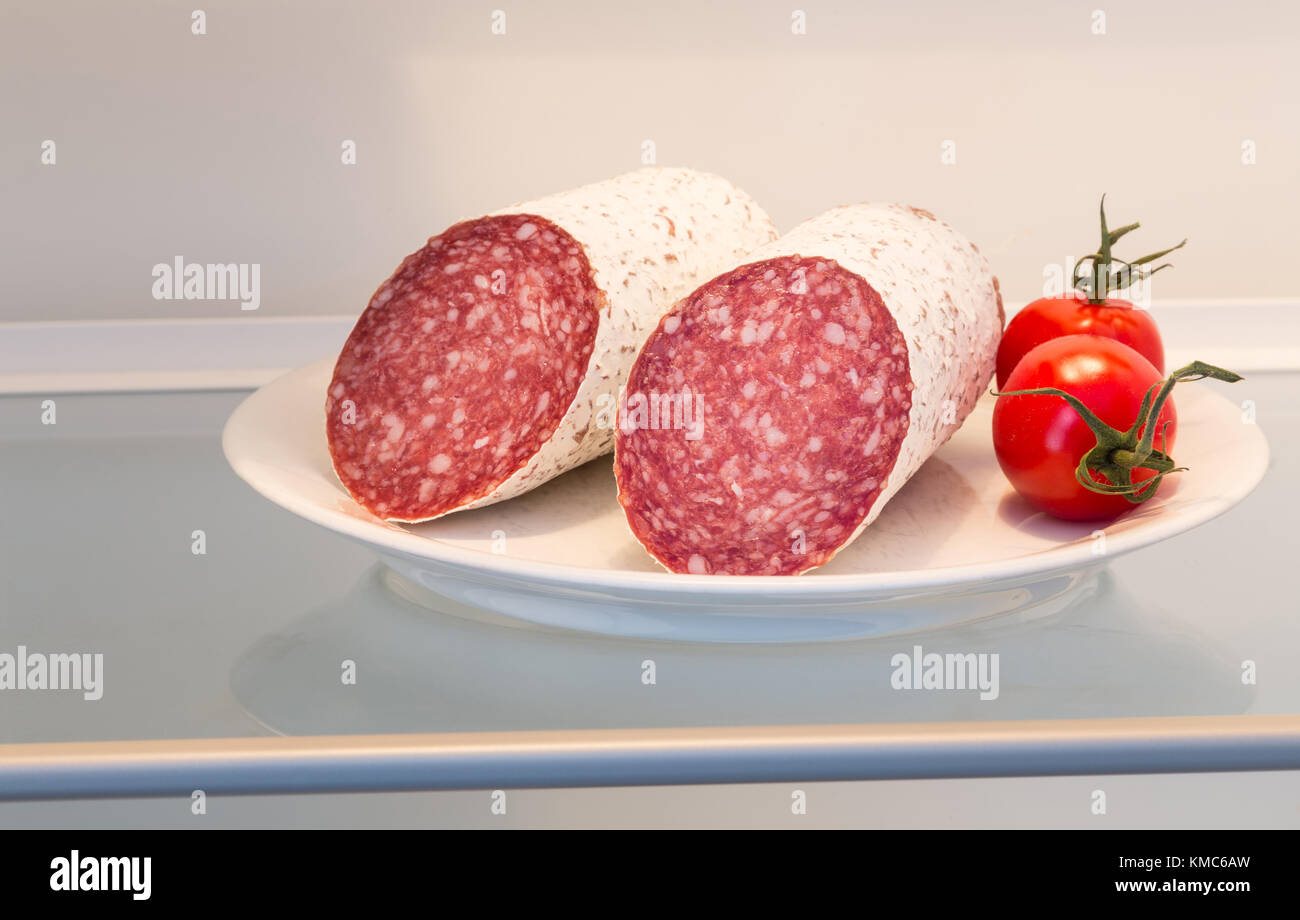 Salami in open refrigerator concept Stock Photo Alamy