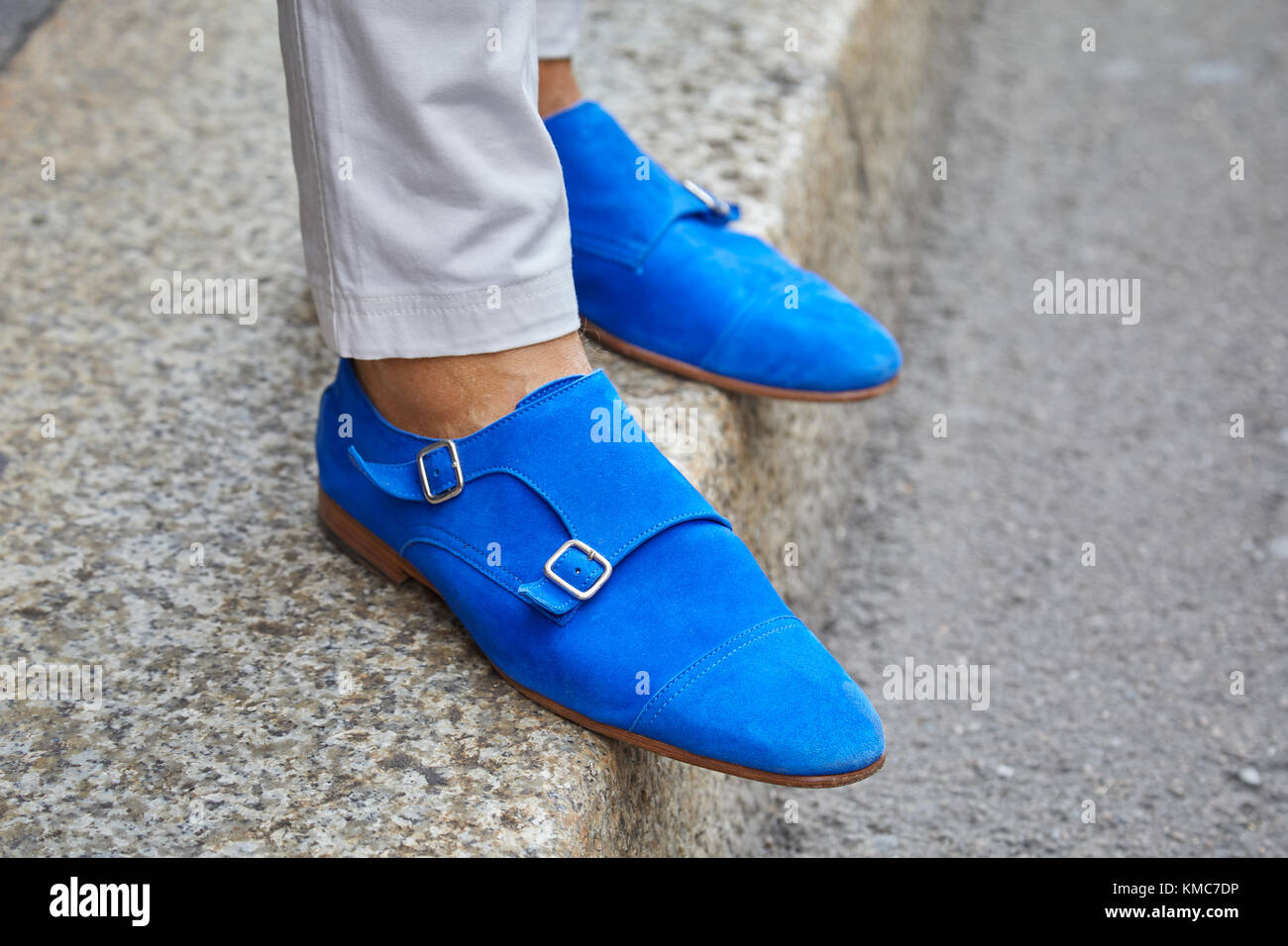 MILAN - SEPTEMBER 23: Man with blue suede leather shoes with belts before Ermanno Scervino fashion show, Milan Fashion Week street style on September  Stock Photo