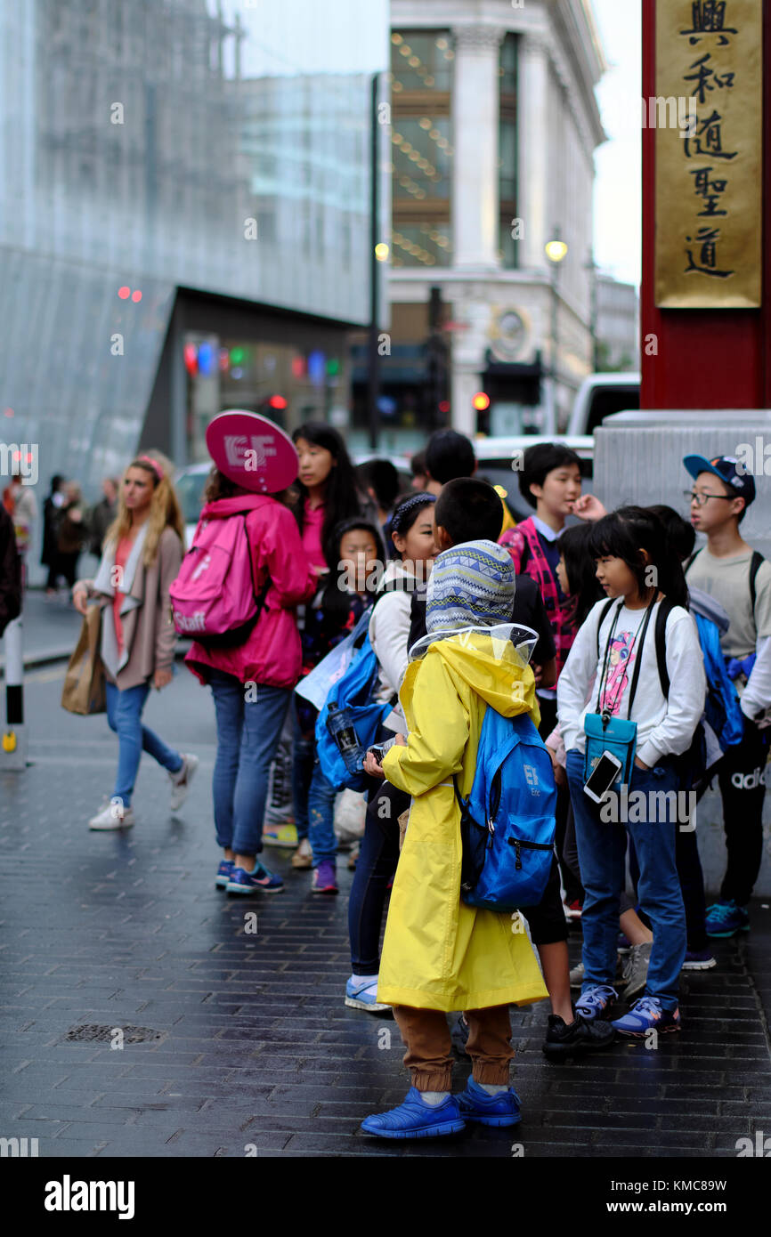 Chinese school children on a shcool trip in Chinatown, Soho, London, England, UK Stock Photo