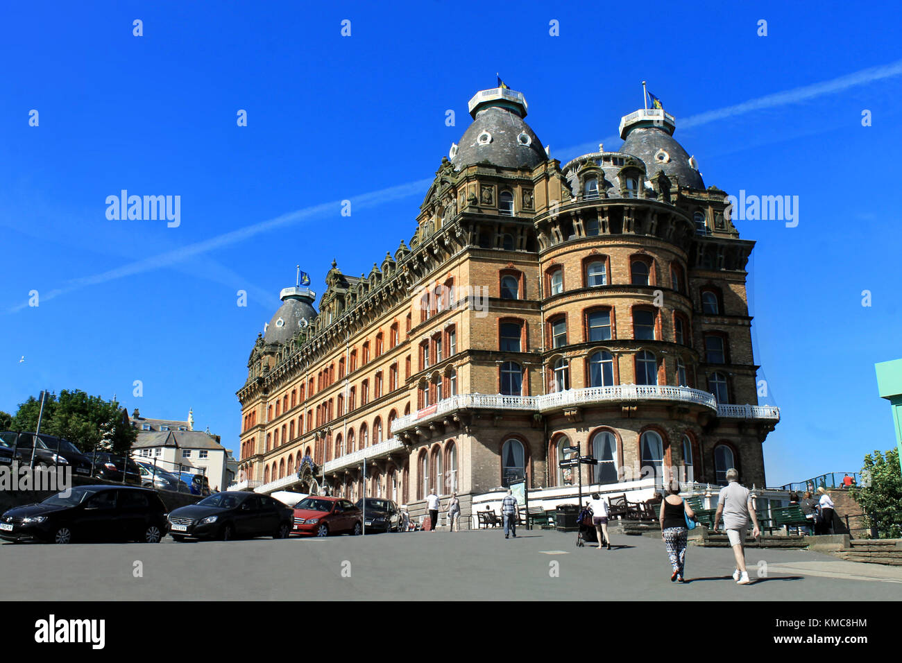SCARBOROUGH, NORTH YORKSHIRE, ENGLAND - 19th of June 2017: Tourists walking to the Grand Hotel in the town of Scarborough on the 19th of June 2017. Stock Photo