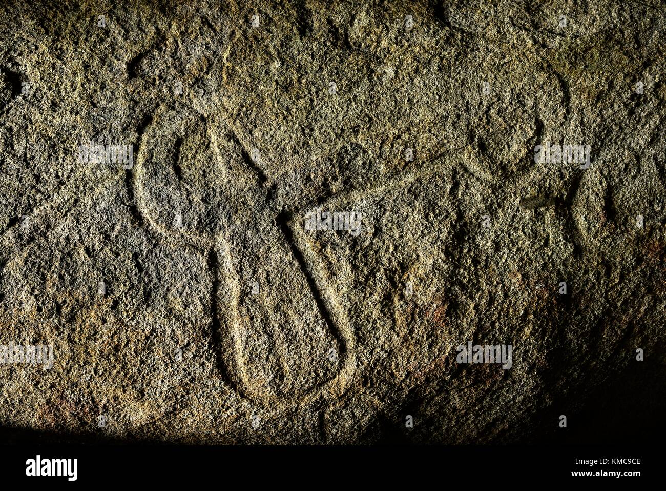 Carved axe-plough motif on inner chamber roof of Table des Marchands. Neolithic galleried grave. Locmariaquer, Brittany, France Stock Photo