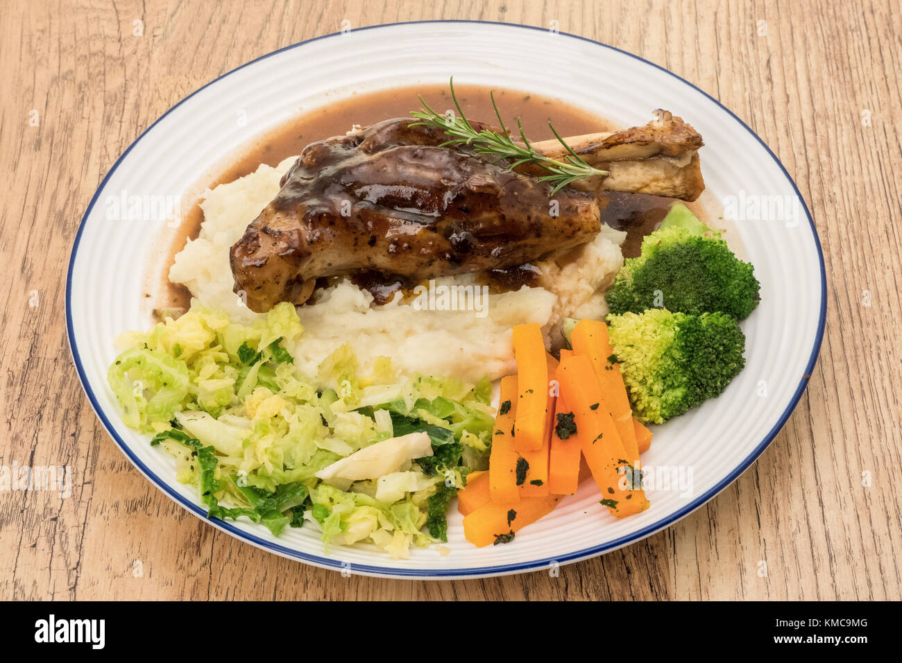 Roasted lamb shank dinner Stock Photo Alamy