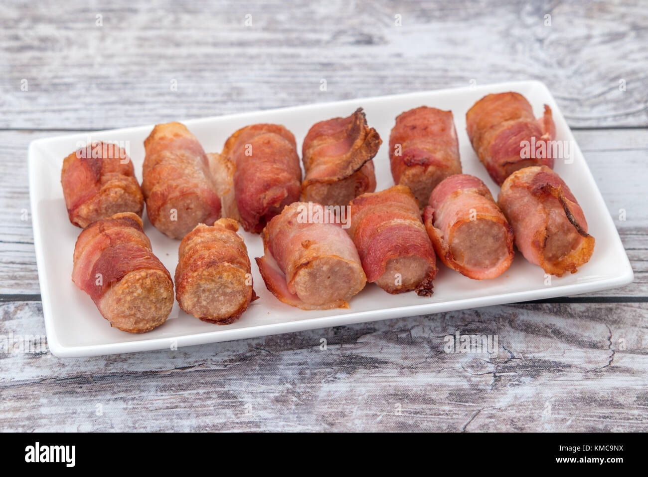 Pigs in blankets pork sausages wrapped in bacon Stock Photo Alamy