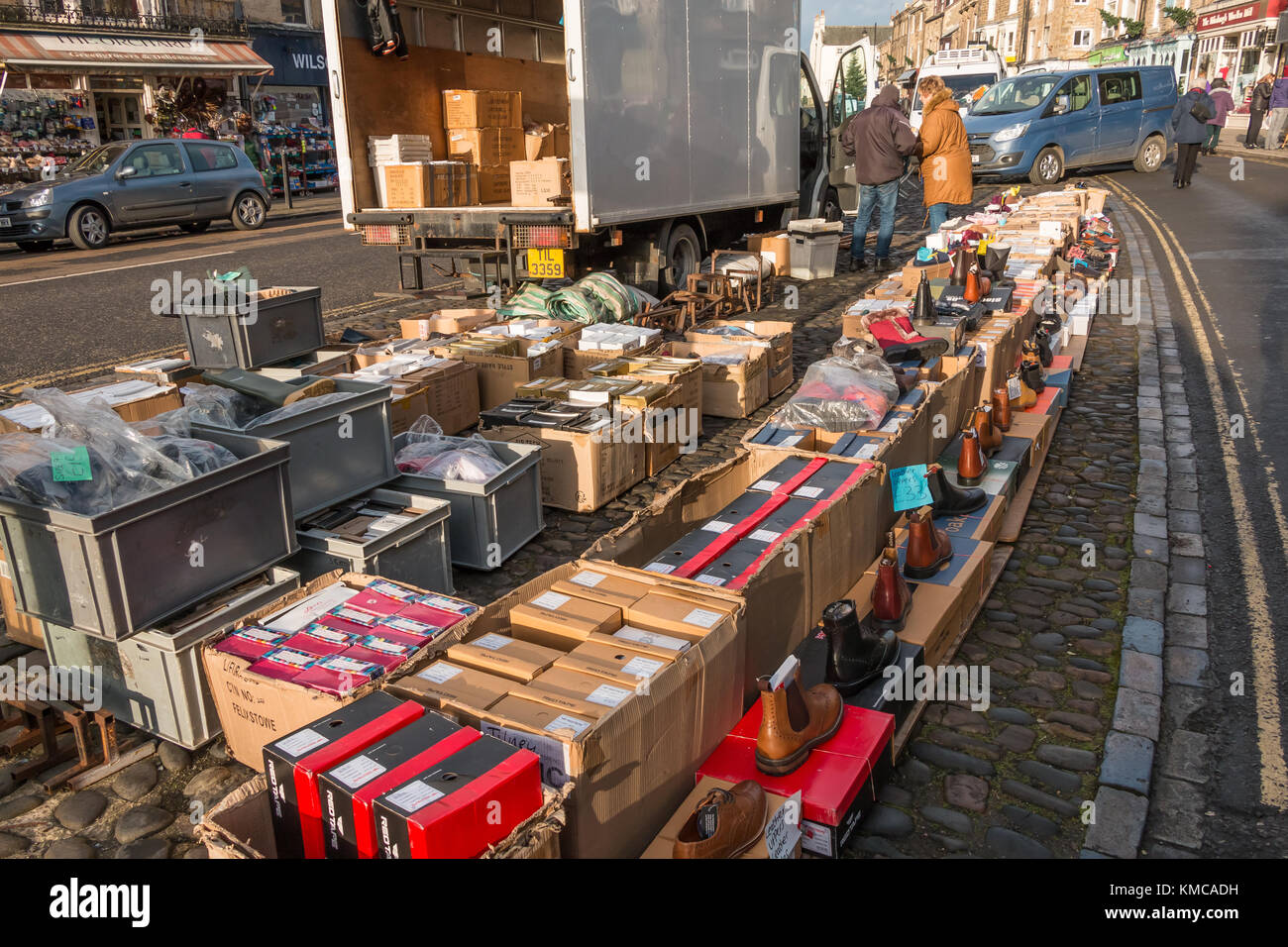 Boot and Shoe Stall, Barnard Castle Market, Teesdale, North East England, UK. December 2017