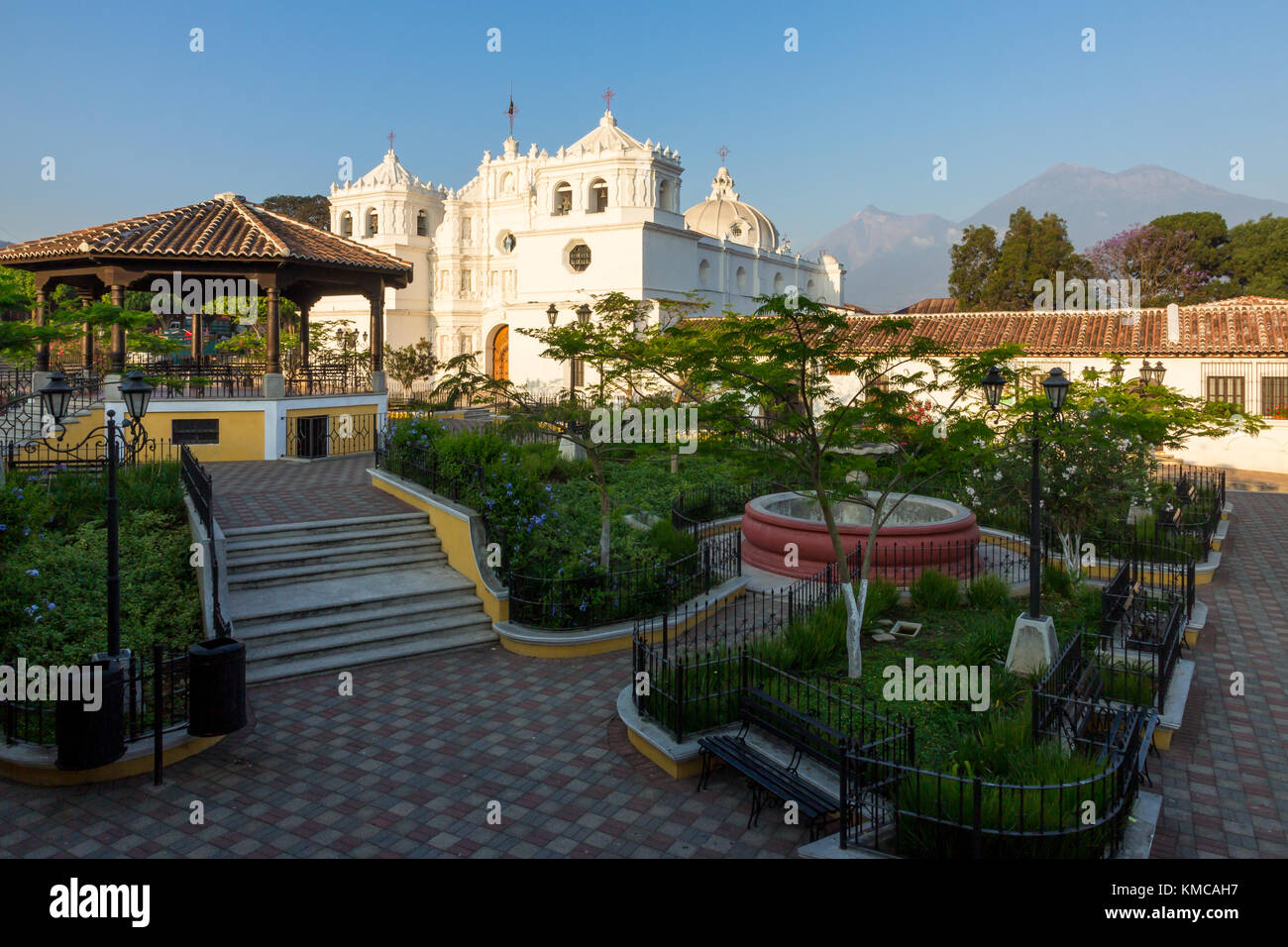 Main square with view to the volcanoes Acatenango and Fuego in the background | Ciudad Vieja | Guatemala Stock Photo