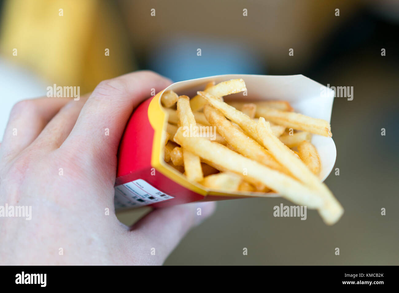 Hand holding french fries in hires stock photography and images Alamy