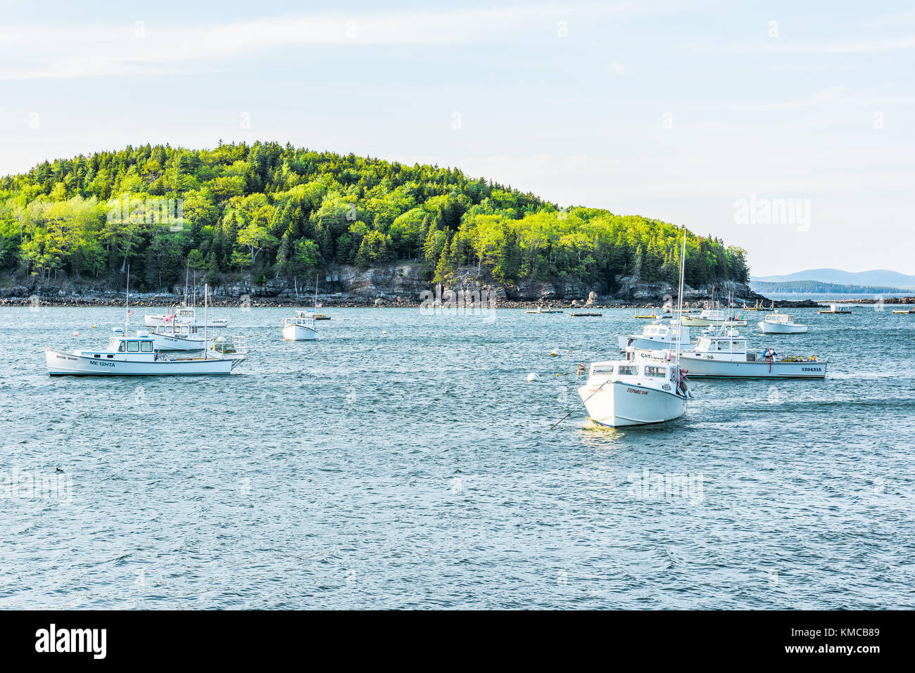 Bar Harbor, USA - June 8, 2017: Sunset in Bar Harbor, Maine village with empty sailing boats, vessels, ships on water Stock Photo