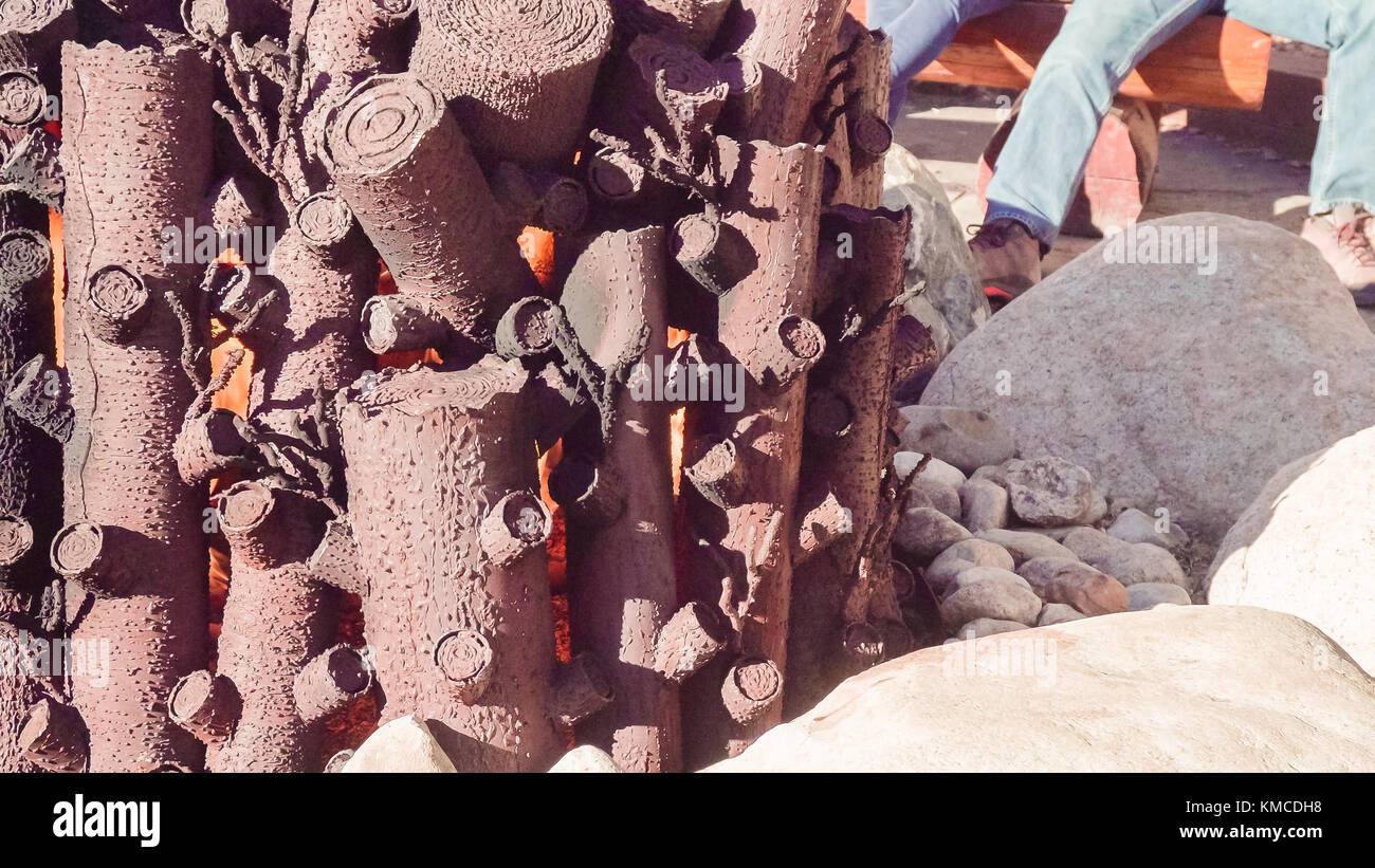 Outdoor Fireplace With Metal Logs In Ski Village Stock Photo