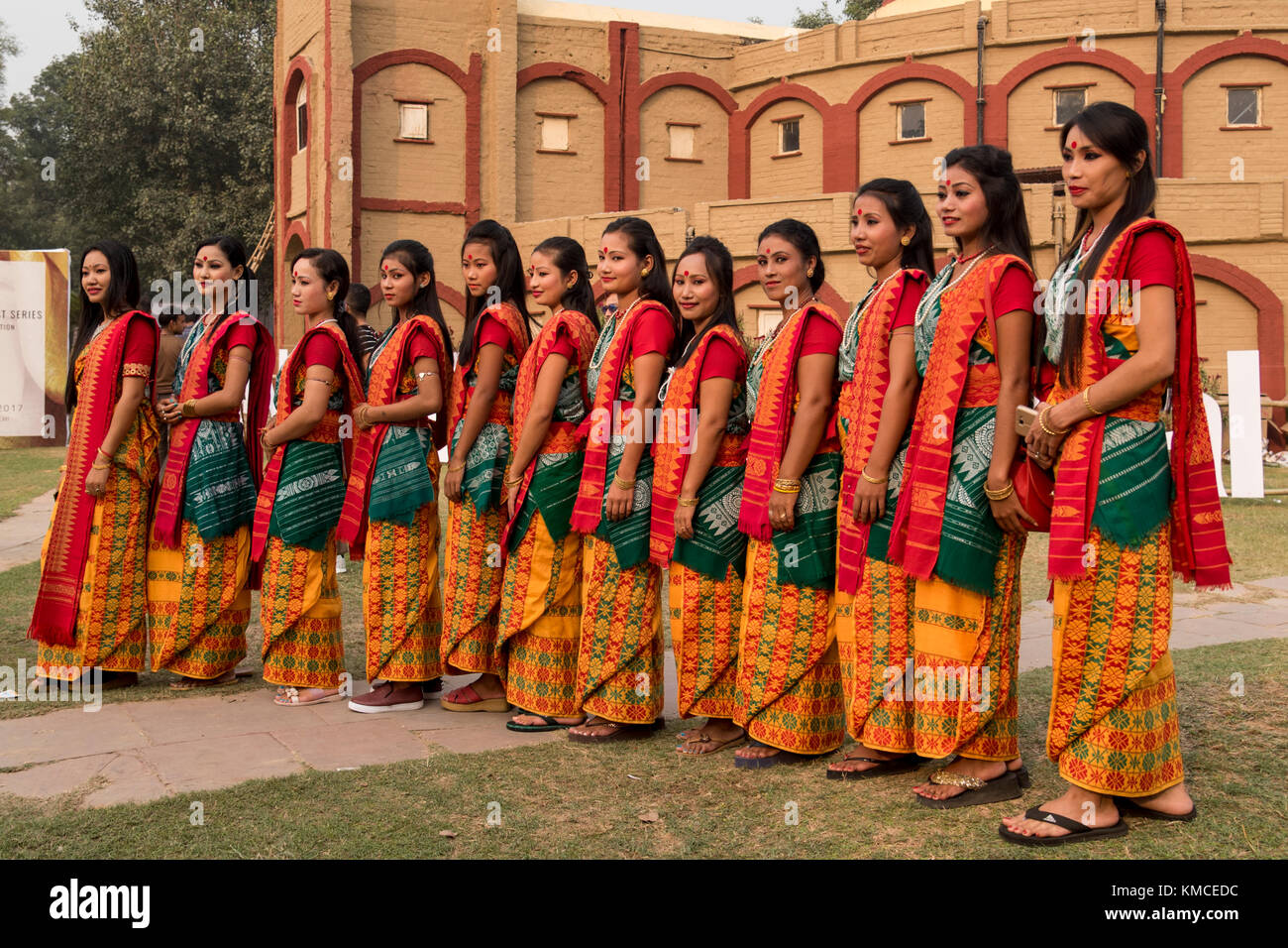 Group of girls from north eastern states standing in a row wearing ethnic dresses. Stock Photo