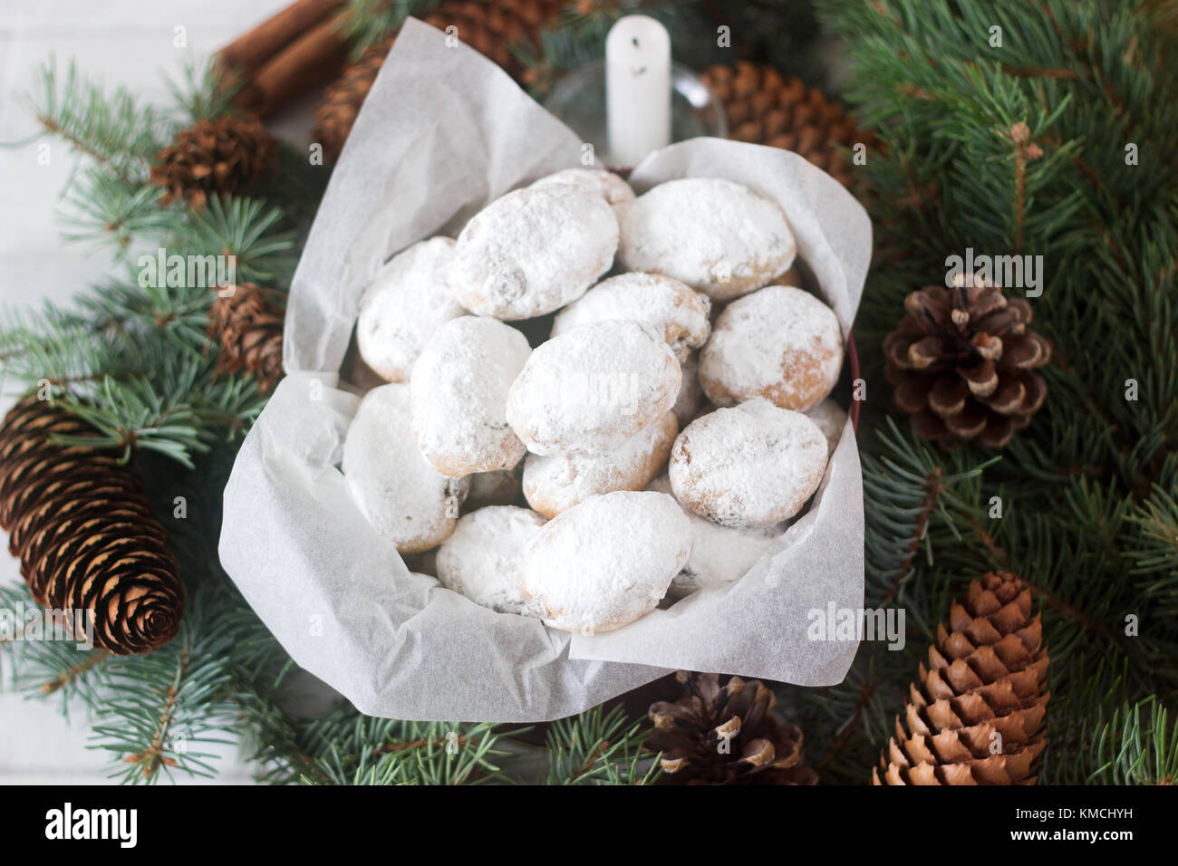 Stollen Candy Mini stollen or stollen candy in a tin on a background of fir branches ...