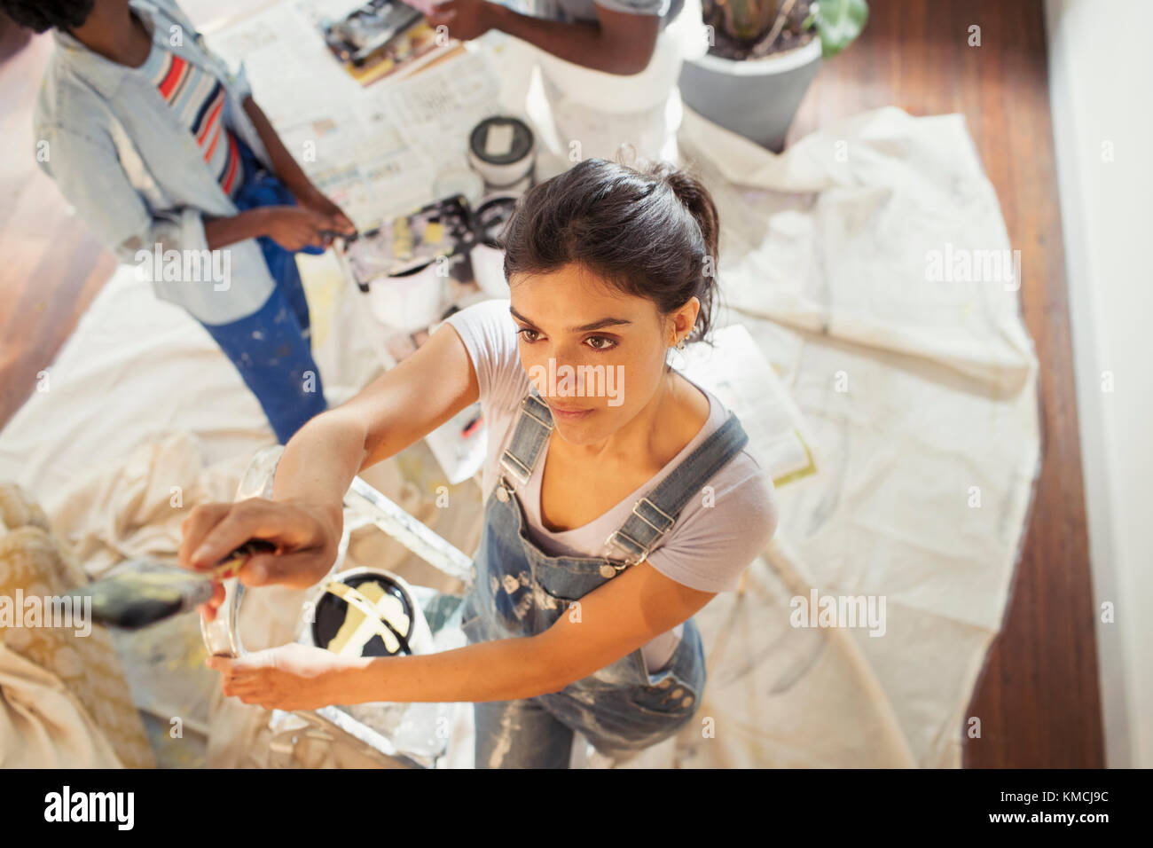 Young woman painting living room Stock Photo