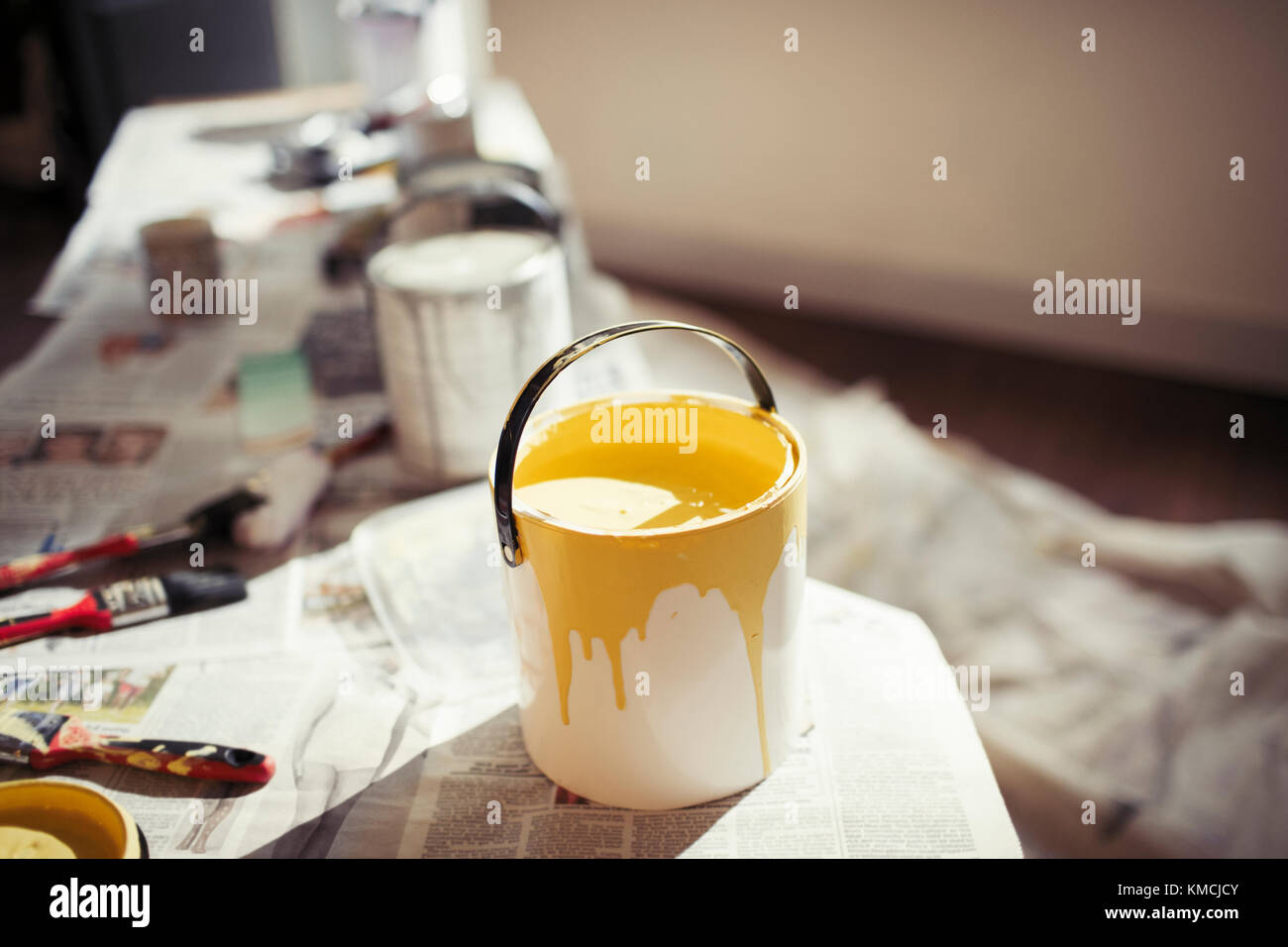 Yellow paint in paint can Stock Photo