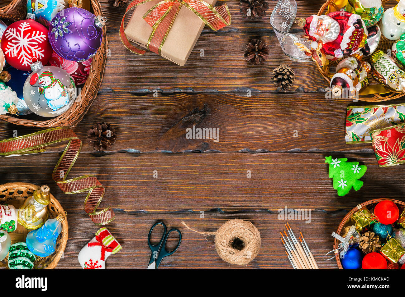 Christmas  background with decorations and gift boxes, balls, toy on vintage old wooden board. Beautiful xmas frame. Idea for advertising, posters, fl Stock Photo