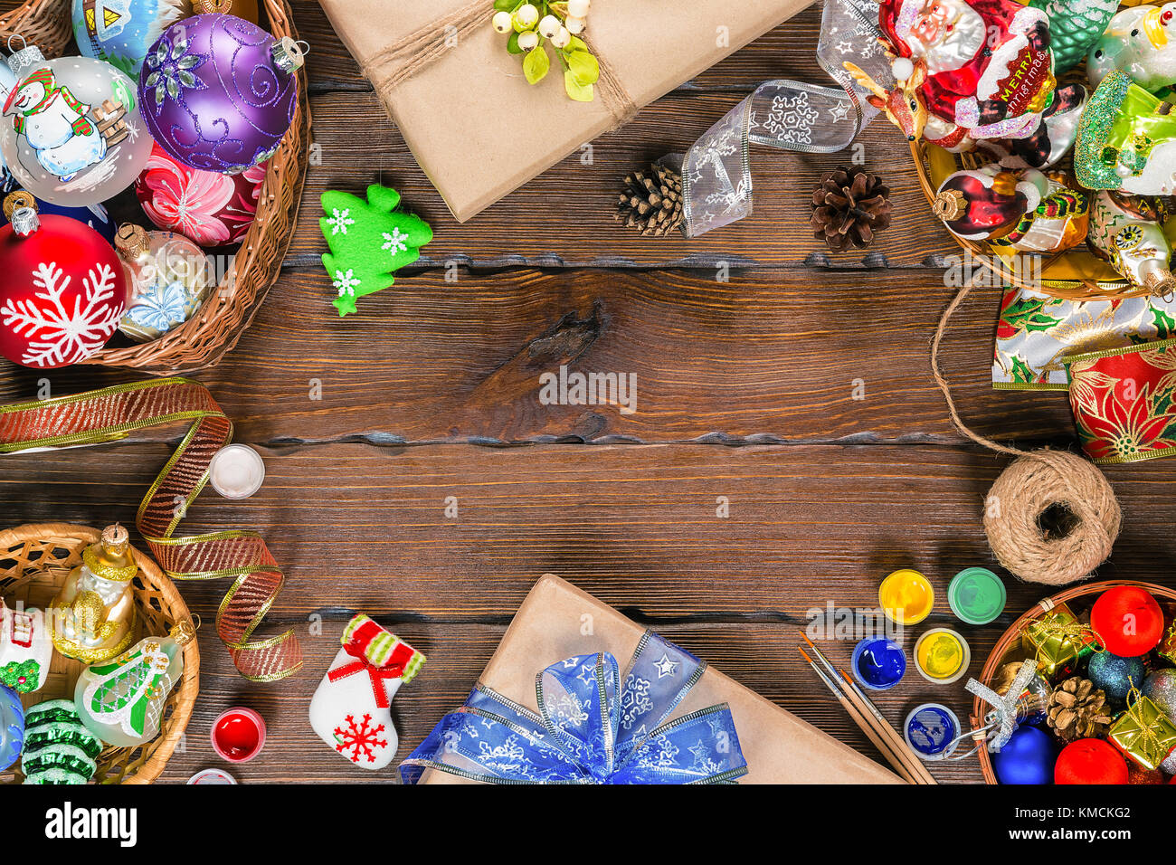 Christmas  background with decorations and gift boxes, balls, toy on vintage old wooden board. Beautiful xmas frame. Idea for advertising, posters, fl Stock Photo