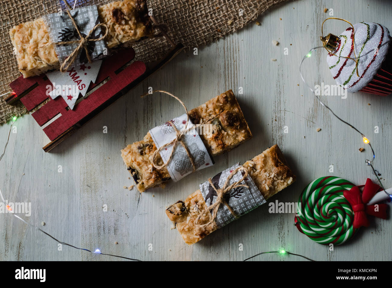 Christmas cookies, red apples, and lights Stock Photo